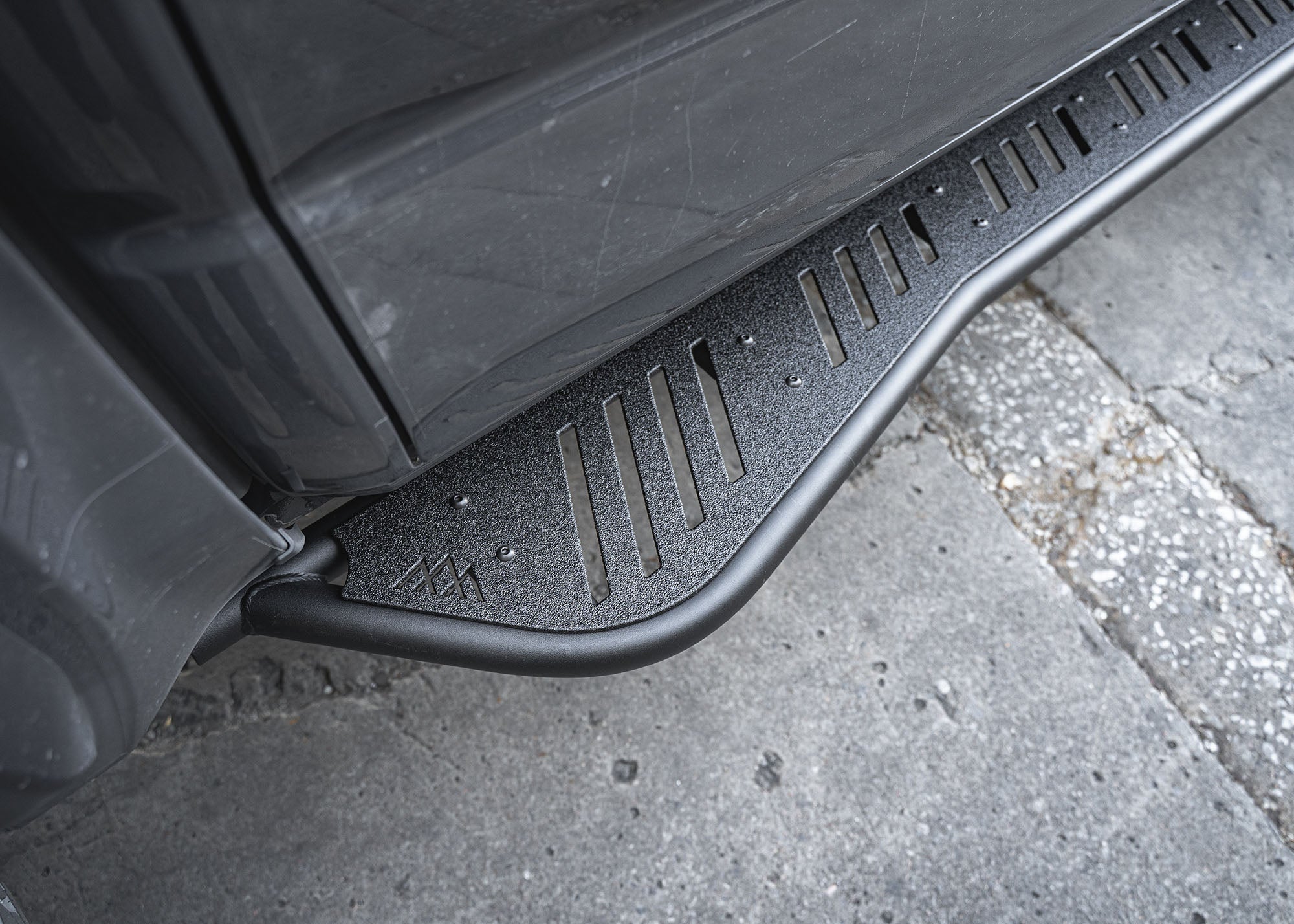 Close up of the kick out and side step on the 2024+ Toyota Tacoma Rock Sliders from Backwoods Adventure Mods