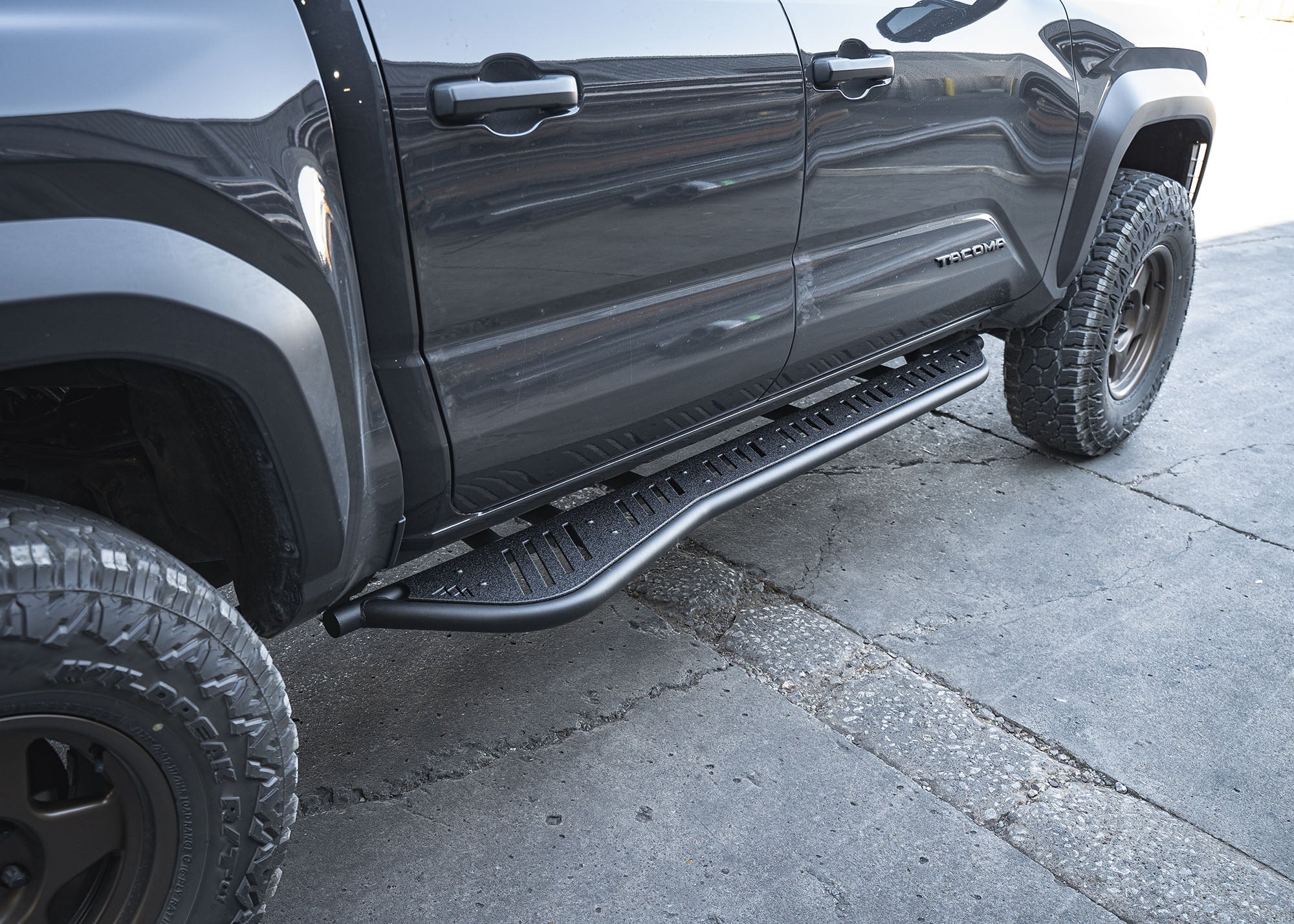 Close up of the removable aluminum top plate for the side step on the 2024+ Toyota Tacoma Rock Sliders from Backwoods Adventure Mods