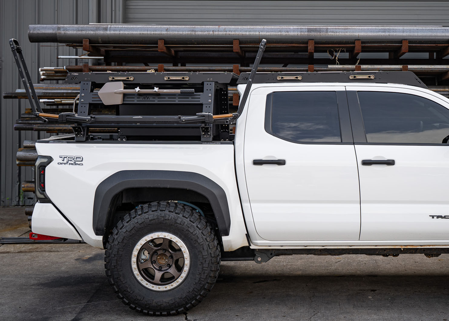 Backwoods Adventure Mods overland truck bed rack and roof rack with accessories installed on a 2024 4th gen Toyota Tacoma