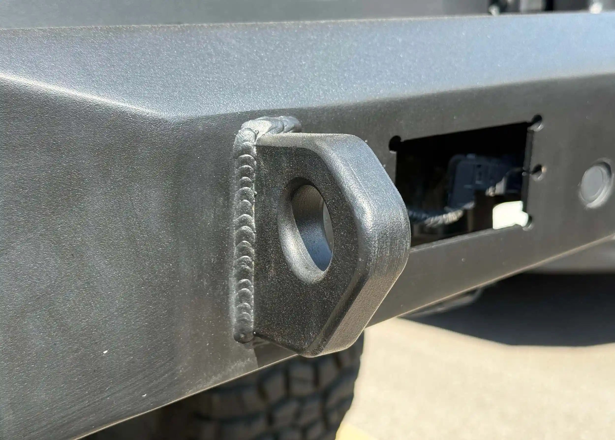 Close-up of off road recovery points on the Backwoods Adventure Mods 2024 Toyota Tacoma Rear Bumper 
