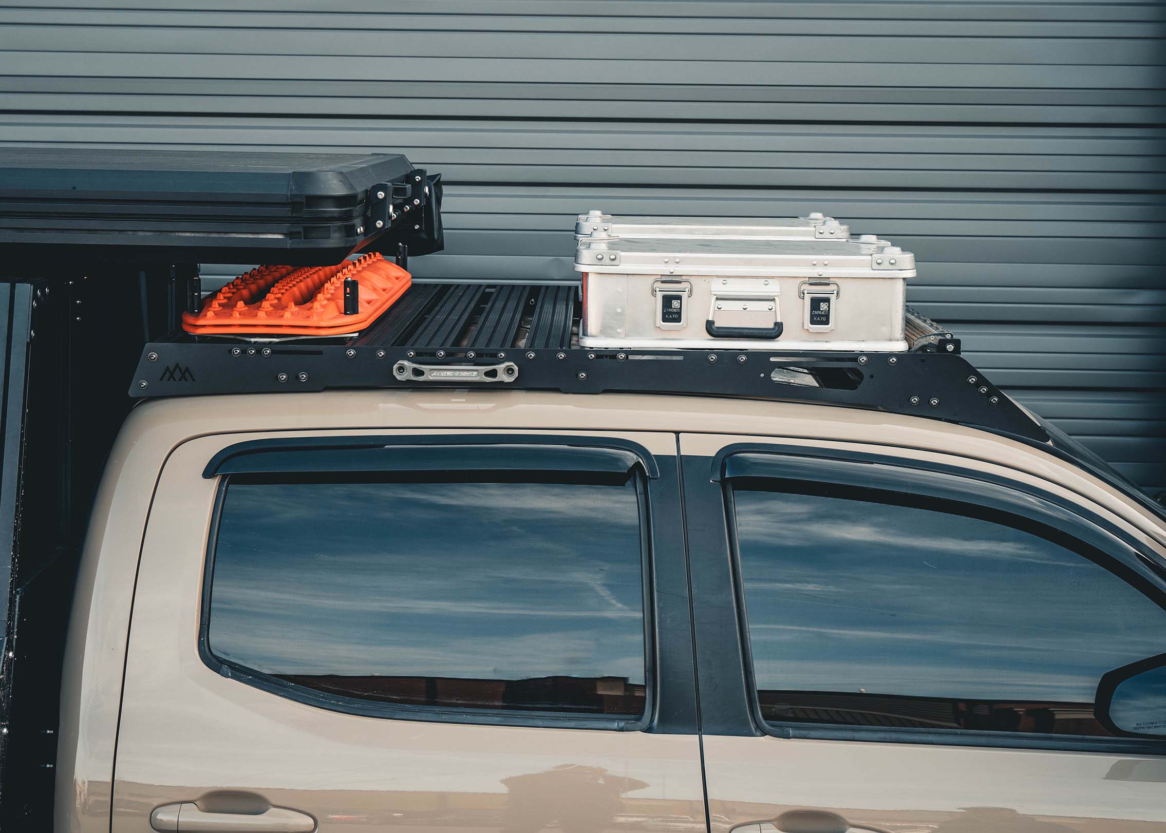 Backwoods Adventure Mods 2005-2023 2nd and 3rd Gen Toyota Tacoma DRIFTR Roof Rack with off road accessories and cargo boxes mounted 