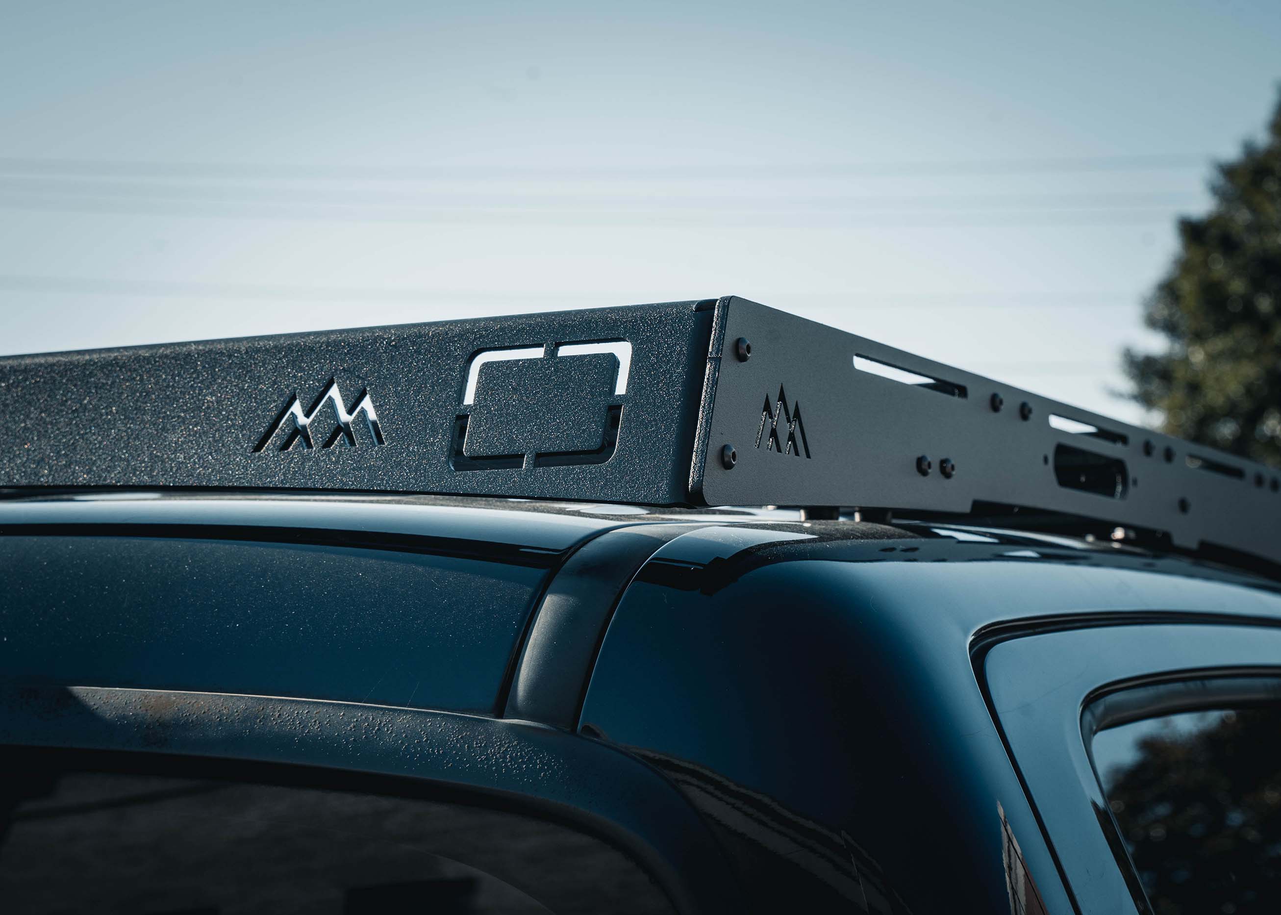 Close-up image of the rear fairing of the Backwoods Adventure Mods 2005-2023 2nd and 3rd Gen Toyota Tacoma DRIFTR Roof Rack cargo carrier