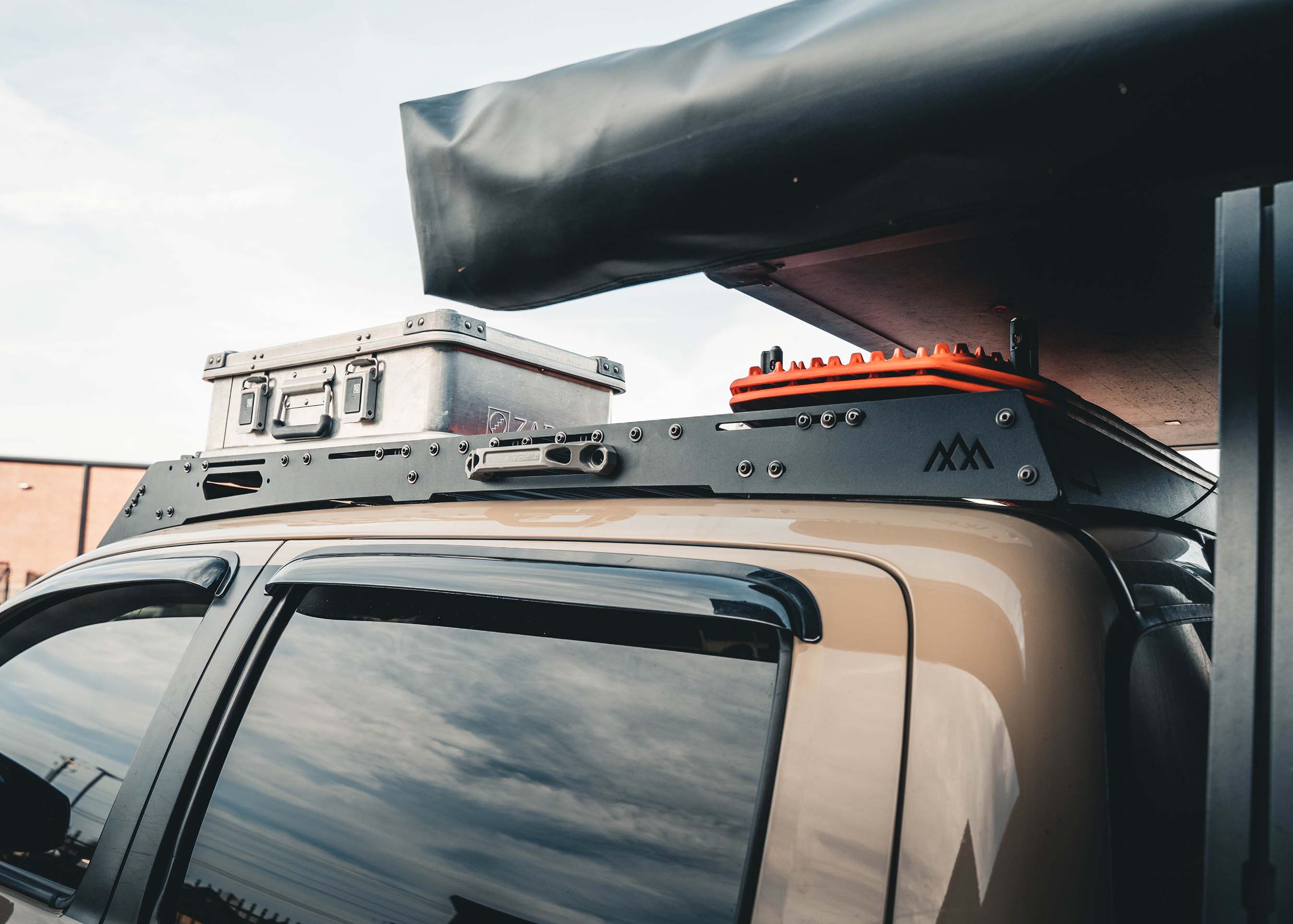 Image showing the side of the Backwoods Adventure Mods 2005-2023 2nd and 3rd Gen Toyota Tacoma DRIFTR Roof Rack cargo carrier