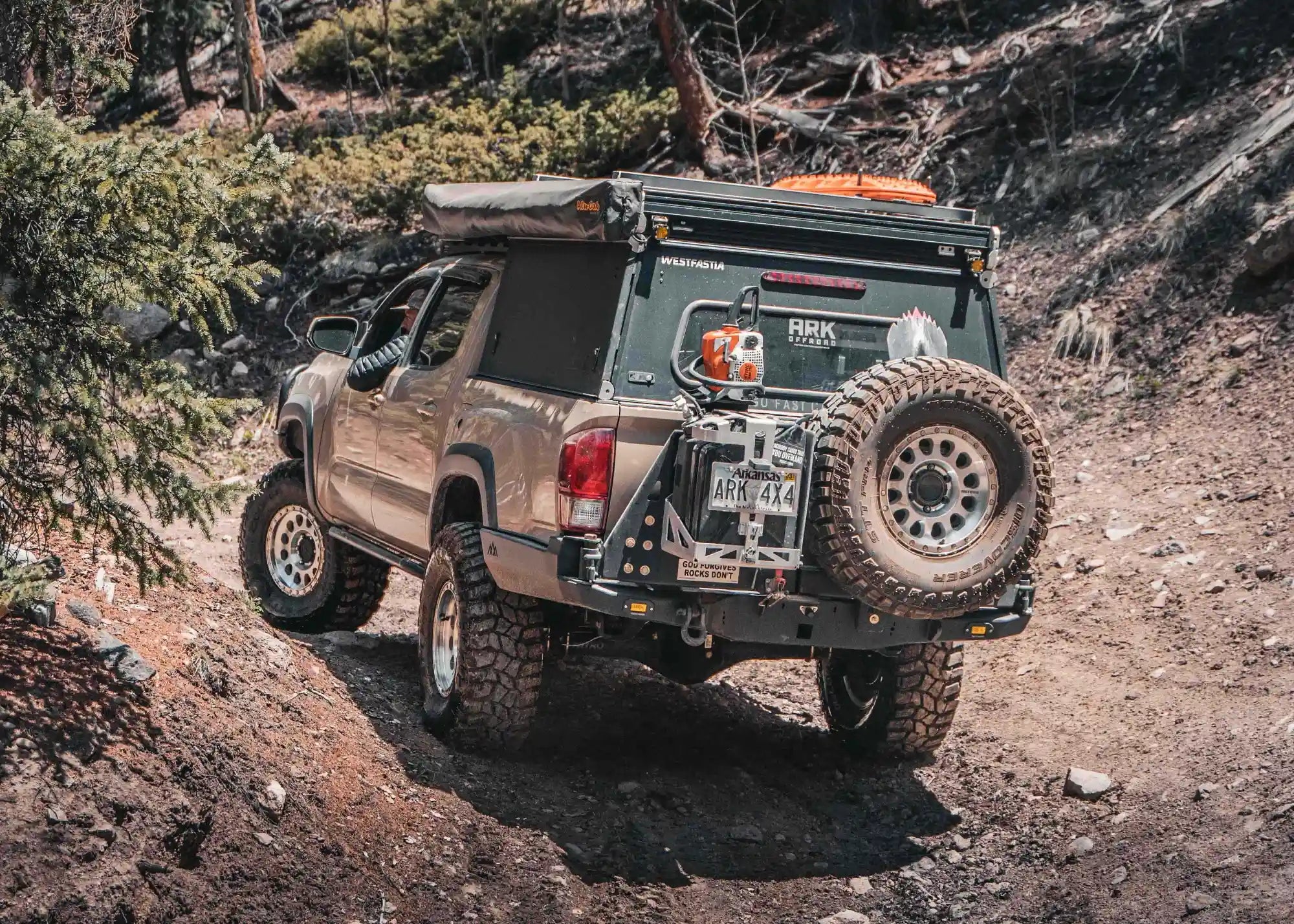 Backwoods Adventure Mods 2016-2023 3rd Gen Toyota Tacoma Hi-Lite High Clearance Dual Swing Out Rear Bumper in use while off roading