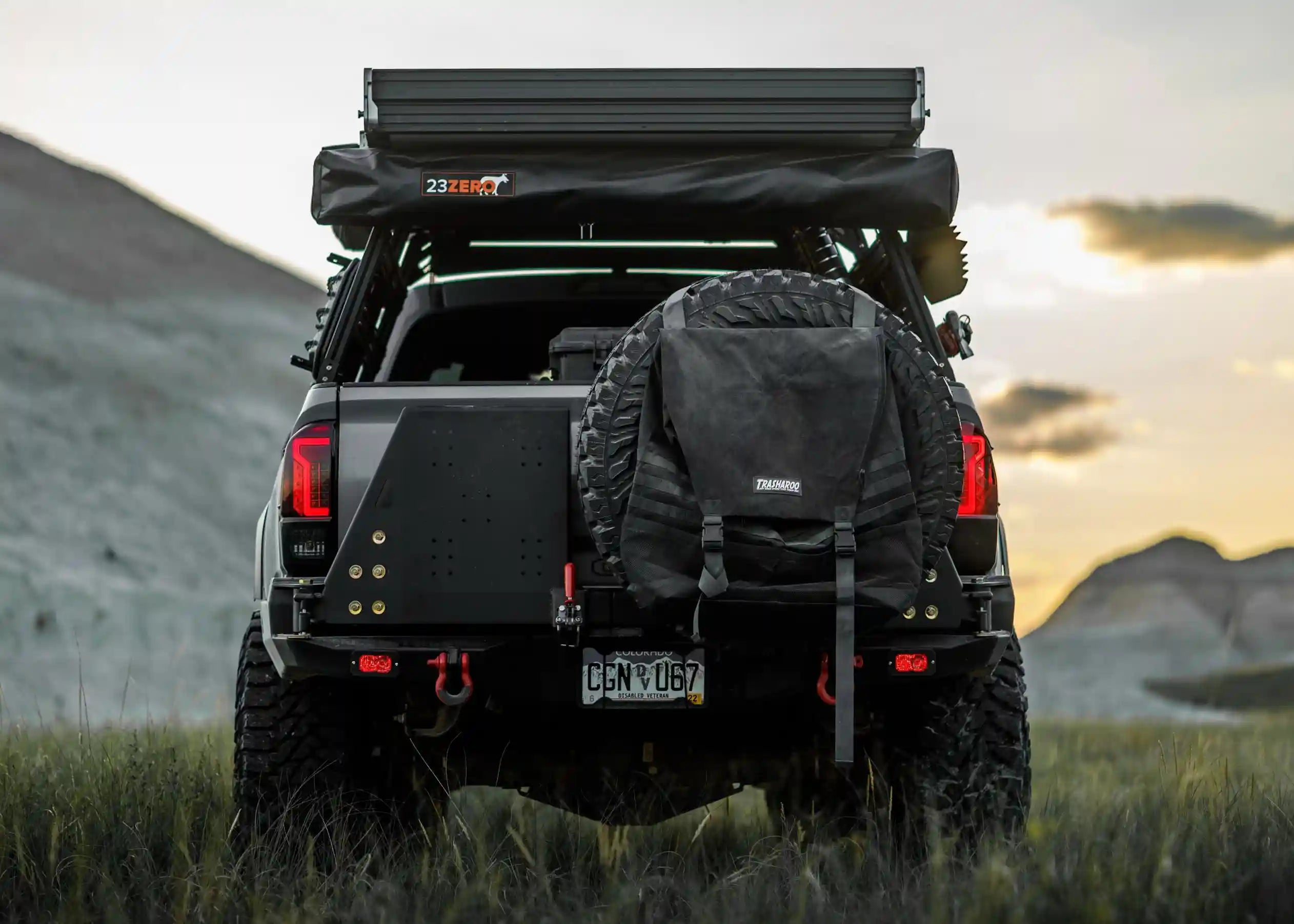 Rear-facing image of the Backwoods Adventure Mods 2016-2023 3rd Gen Toyota Tacoma Hi-Lite High Clearance Dual Swing Out Rear Bumper with both swing outs closed