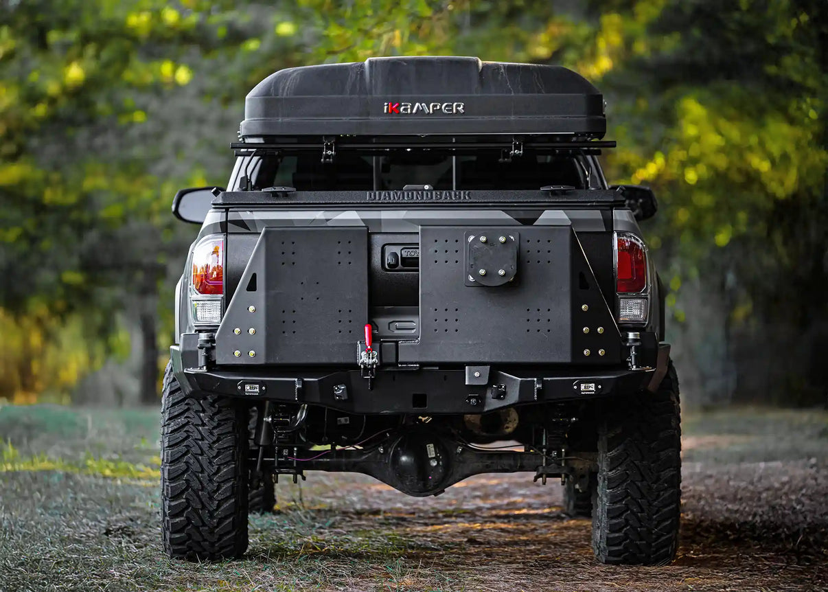 Image of the 2016-2023 3rd Gen Toyota Tacoma Hi-Lite High Clearance Dual Swing Out Rear Bumper from Backwoods Adventure Mods with both swing outs closed