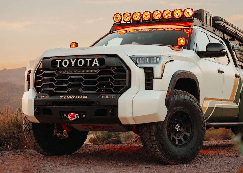 White Toyota Tundra in the desert at dusk with a Backwoods Adventure Mods 2022 2023 2024 2025 3rd Gen Tundra High Clearance Front Bumper installed