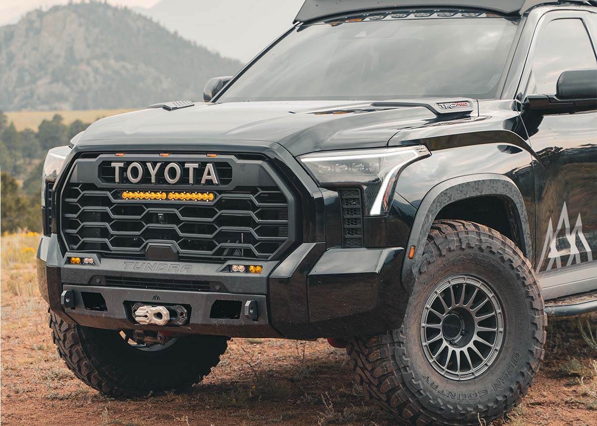 Backwoods Adventure Mods Hybrid 3rd Gen Tundra Front Bumper for 2022 2023 2024 2025 models installed on a black Toyota Tundra
