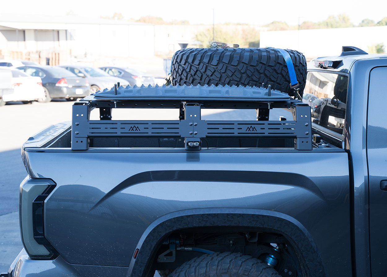 Side image of the 2022+ 3rd Gen Toyota Tundra Mid Height Bed Rack by Backwoods Adventure Mods 