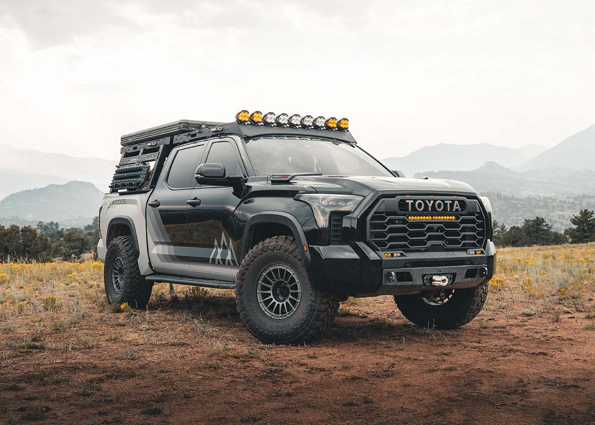 Black Toyota Tundra overland truck with a Backwoods Adventure Mods 2022 2023 2024 2025 3rd Gen Tundra Off Road Front Bumper installed