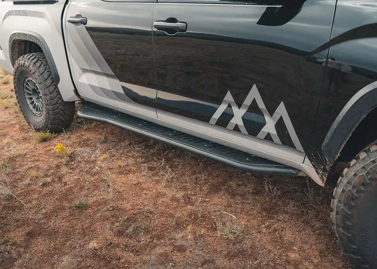 Close up image of the aluminum bolt-on top plate on the Backwoods Adventure Mods 3rd Gen Toyota Tundra Rock Sliders