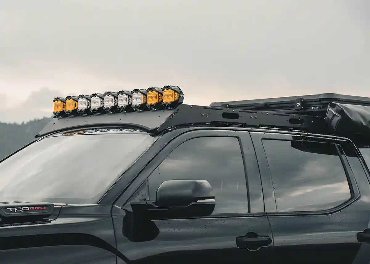 Image of Toyota Tundra 3rd Gen (2022+) DRIFTR Roof Rack by Backwoods Adventure Mods with off road lights mounted over the wind fairing