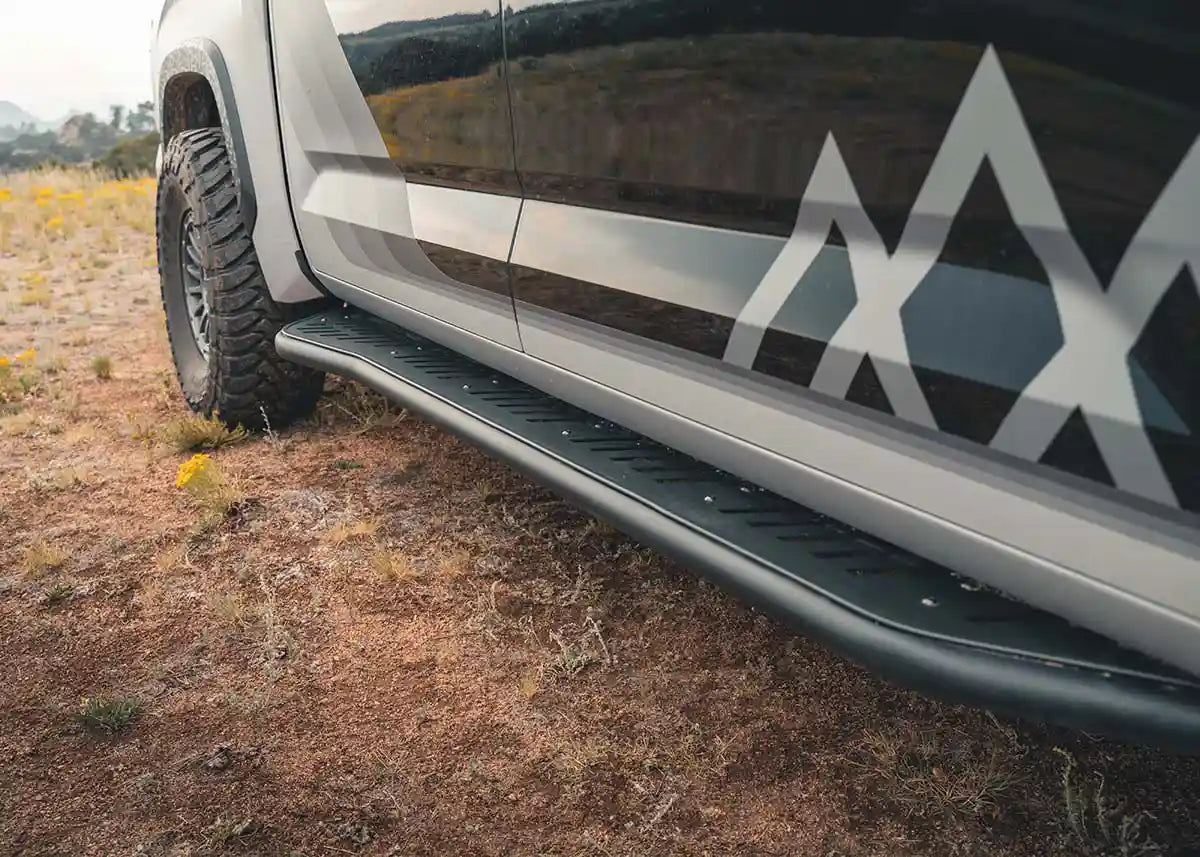 Close-up of the Backwoods Adventure Mods Tundra rock slider included in the Trail Ready off road kit bundle installed on a 2022+ 3rd Gen Toyota Tundra