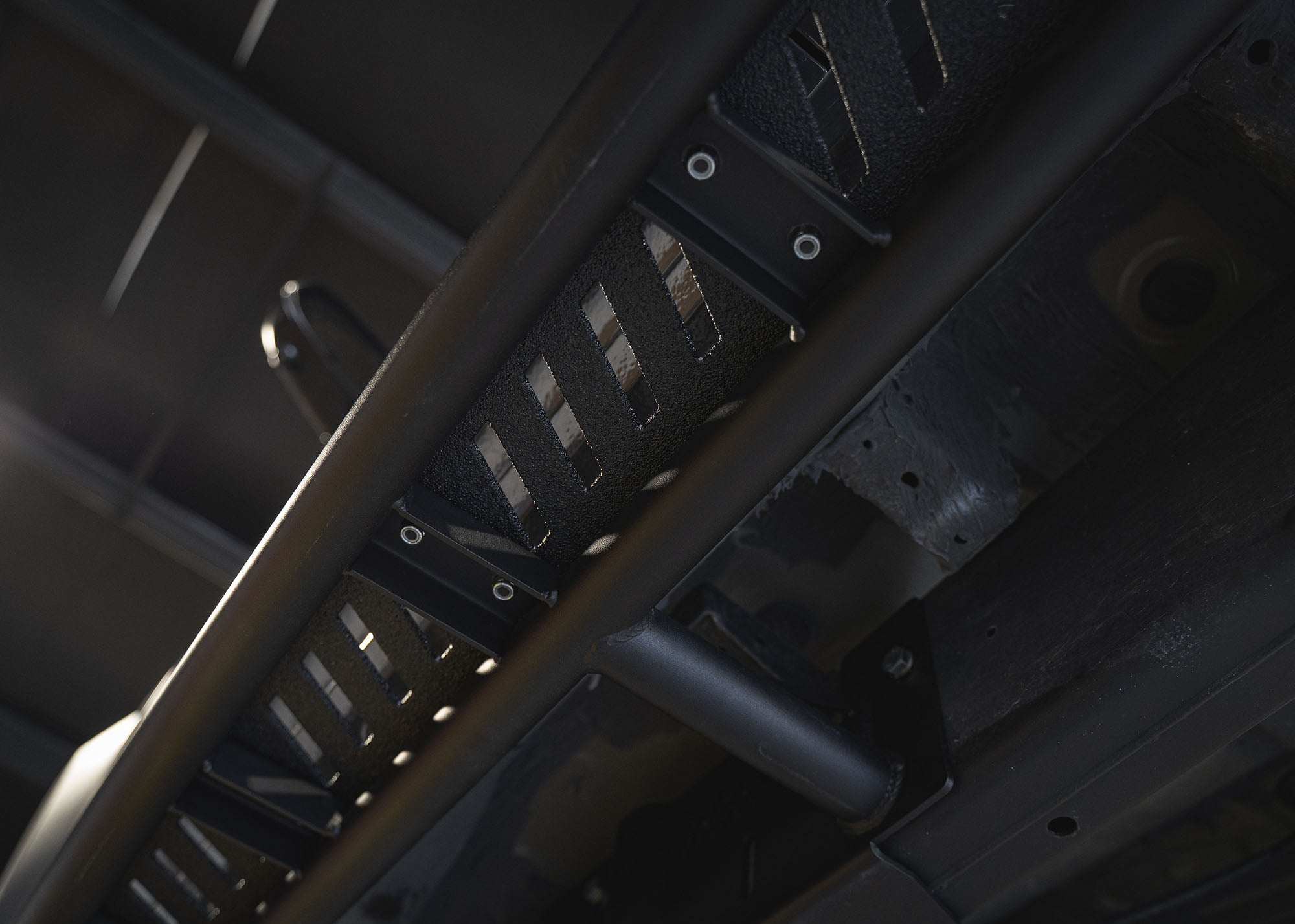 Close up of the mounting bracket and hardware for the 2024+ Toyota Tacoma Rock Sliders from Backwoods Adventure Mods for easy bolt on installation