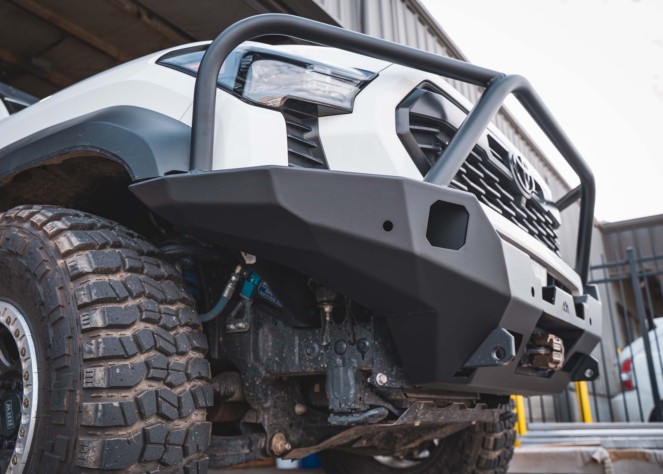 Image showing the improved approach angle of the Backwoods Adventure Mods 4th Gen 2024 Toyota Tacoma Hi-Lite Front Bumper with Bull Bar