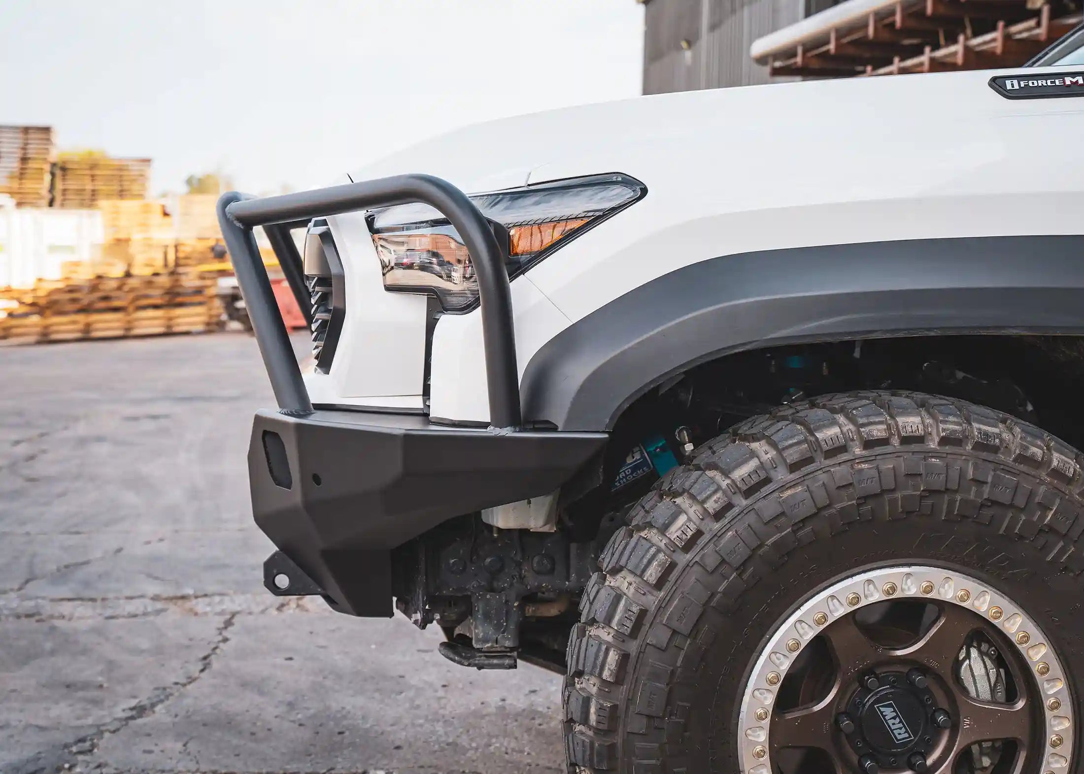 Side profile of the Backwoods Adventure Mods 2024 Toyota Tacoma 4th Gen Hi-Lite Overland Front Bull Bar Bumper