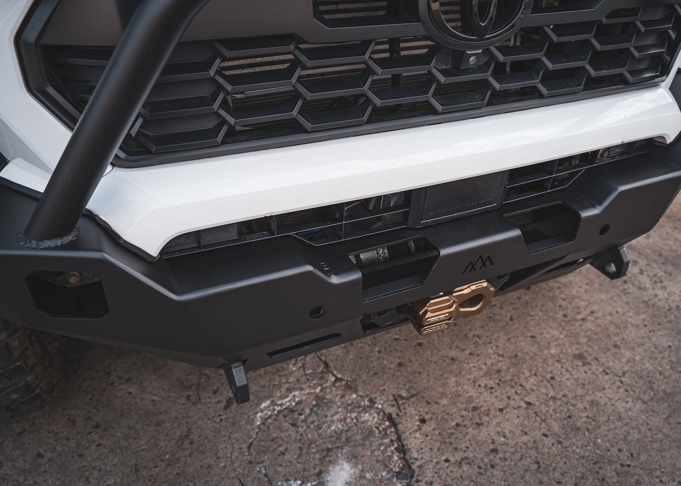 Winch access cutouts on the Backwoods Adventure Mods 4th Gen 2024 Toyota Tacoma Hi-Lite Overland Off Road Front Bull Bar Bumper