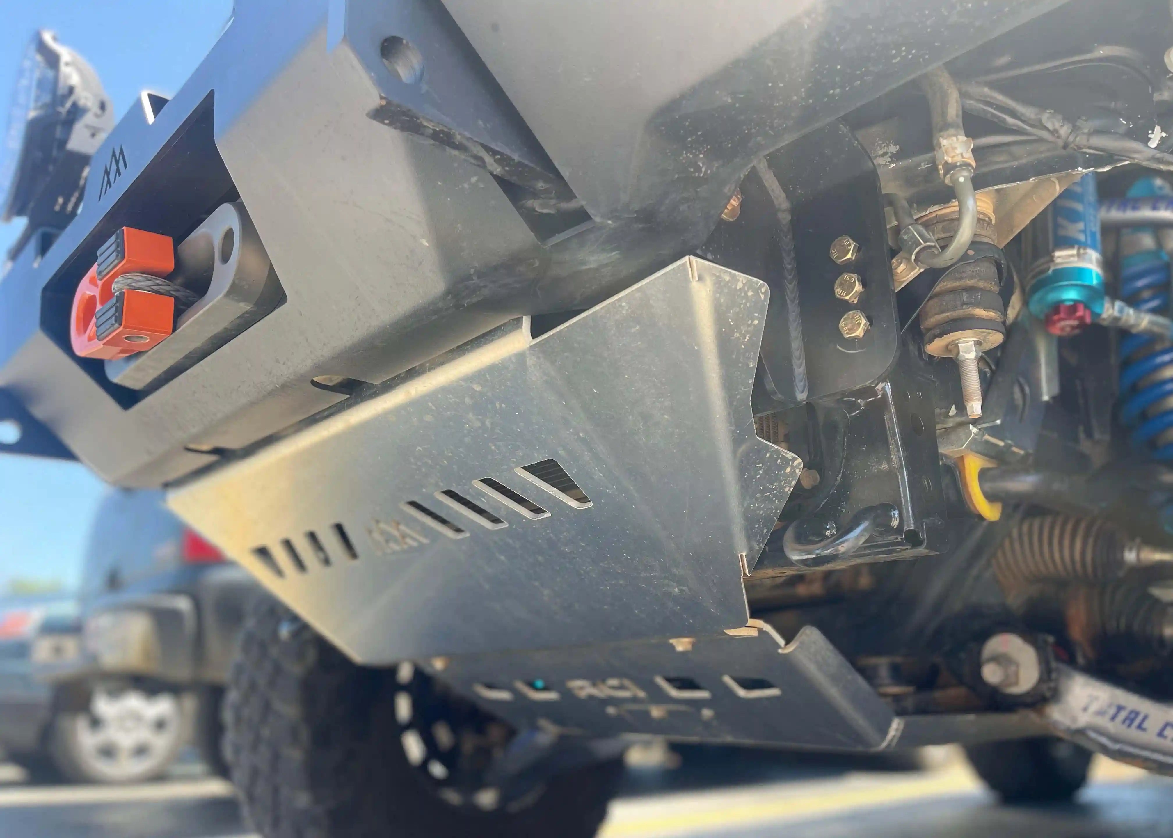 Close up of the Toyota 4Runner (2010-2022) Aluminum Connector Skid Plate installed on a Backwoods Adventure Mods 5th Gen 4Runner Off Road Front Bumper