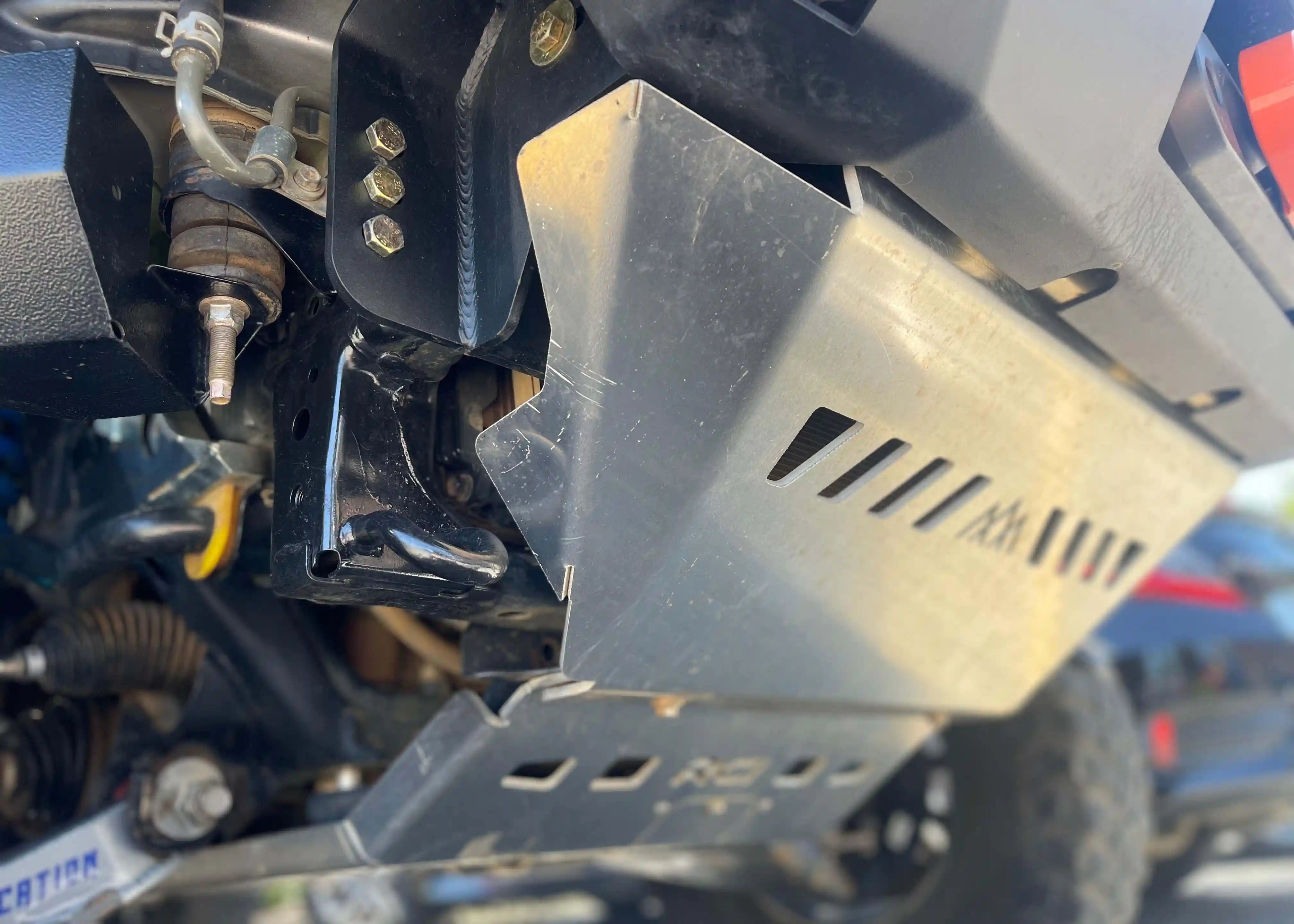 Close up of the mounting surface of the Backwoods Adventure Mods 5th Gen Toyota 4Runner (2010-2022) Aluminum Connector Skid Plate when installed