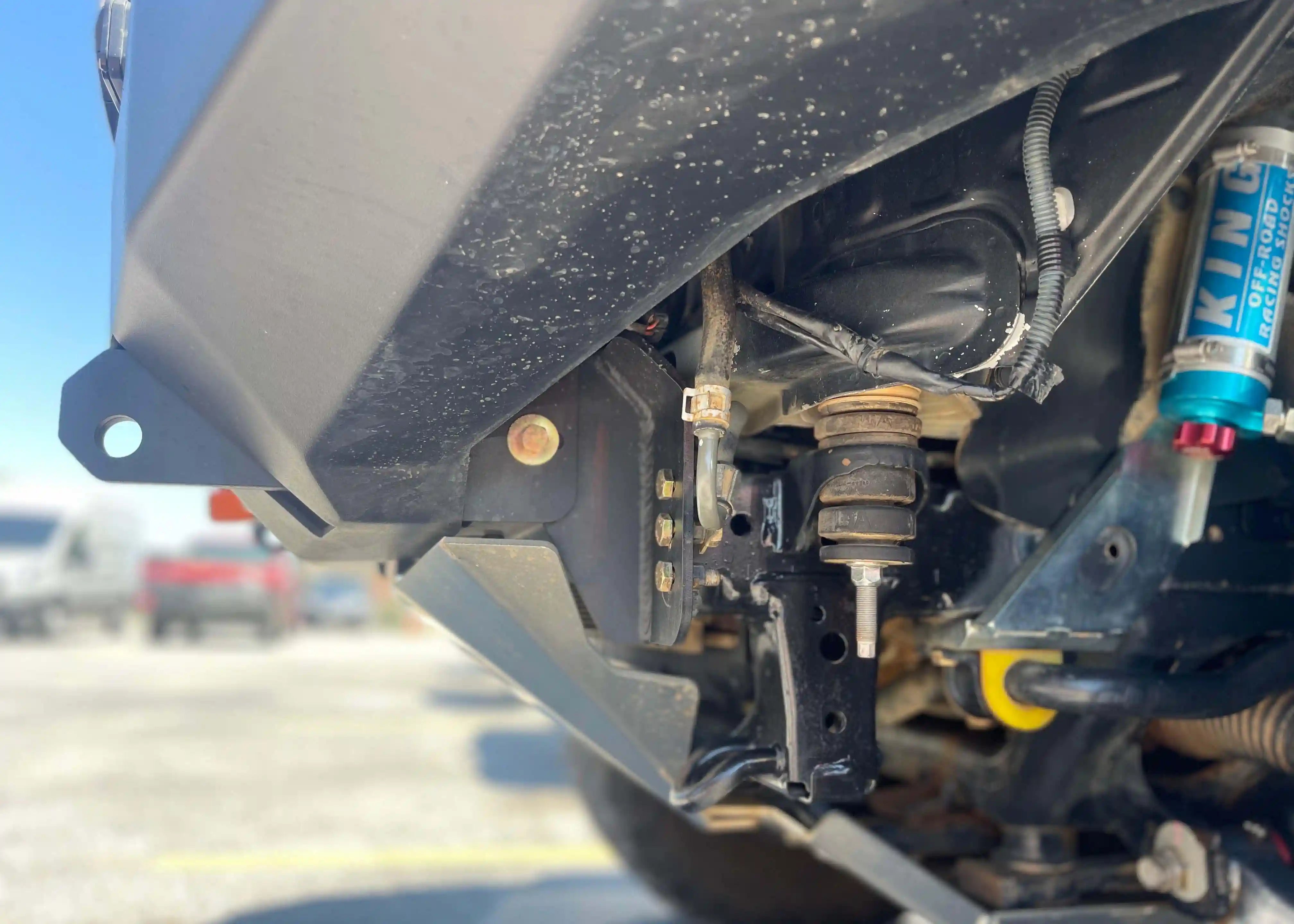 Close up of the side profile of the Backwoods Adventure Mods 5th Gen Toyota 4Runner (2010-2022) Aluminum Connector Skid Plate when installed