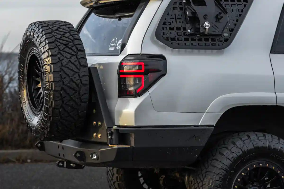 Side profile image of the 5th Gen Toyota 4Runner Hi-Lite High Clearance Dual Swing Out Rear Bumper by Backwoods Adventure Mods
