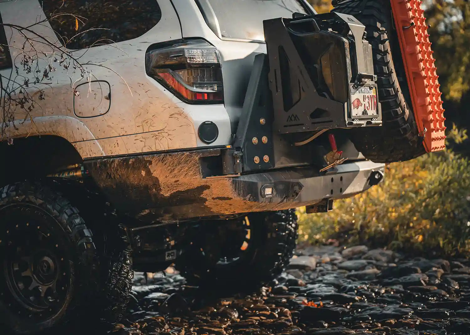 Image showing the improved ground clearance while driving off road with the Backwoods Adventure Mods 5th Gen Toyota 4Runner Hi-Lite High Clearance Dual Swing Out Rear Bumper 