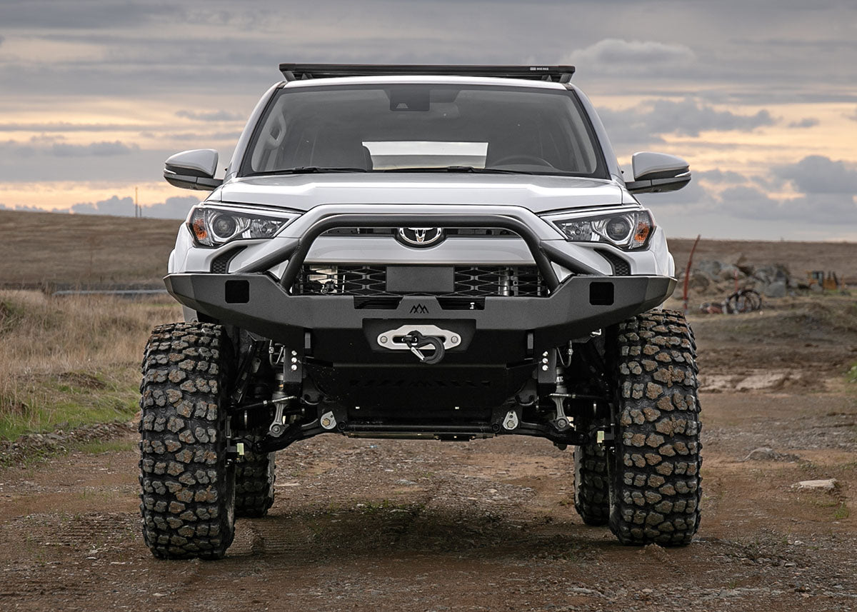 5th Gen Toyota 4runner on portal axles equipped with a Backwoods Adventure Mods Hi-Lite Overland Front winch Bumper with Prerunner Bull Bar 