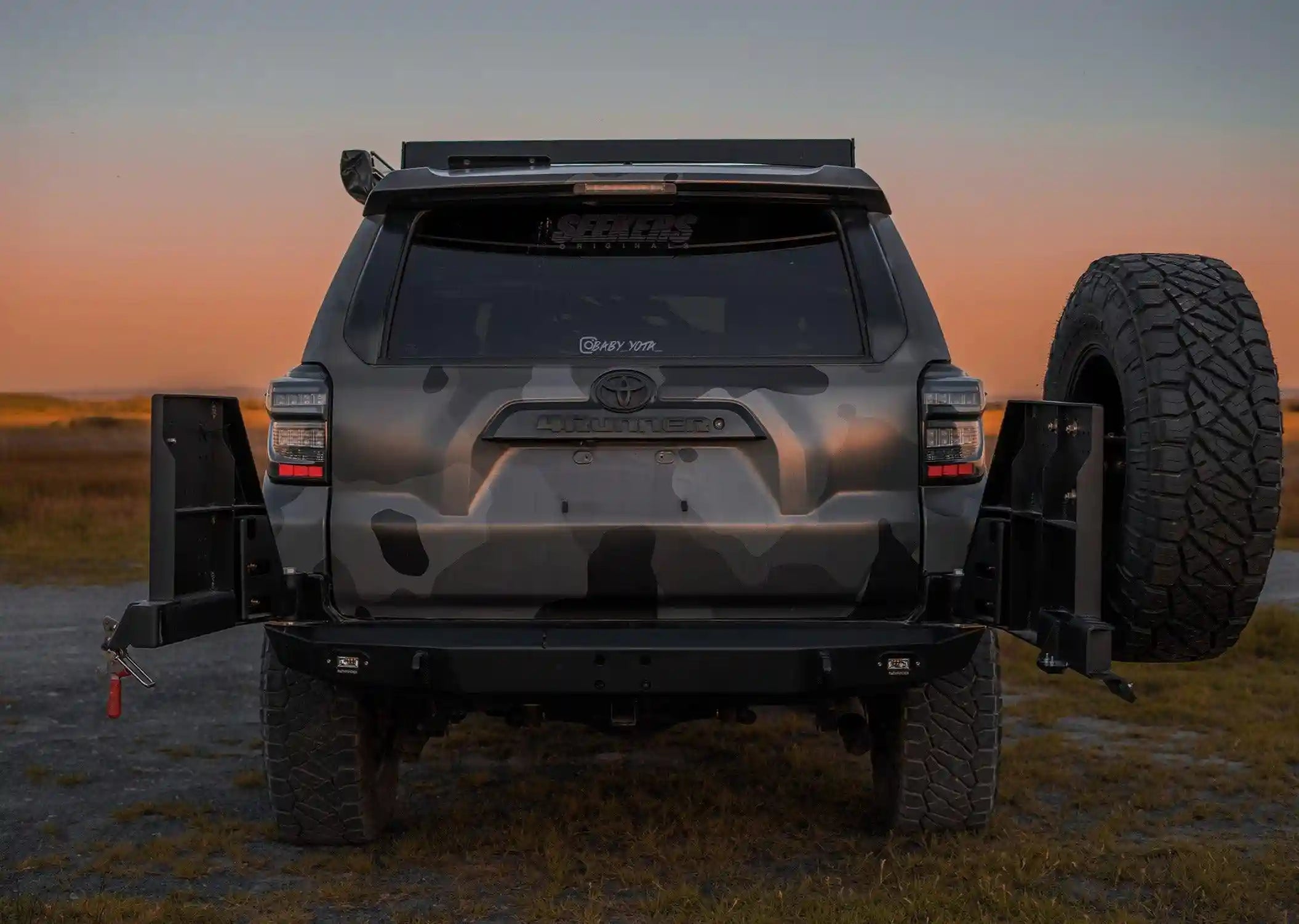 Rear facing image of the Backwoods Adventure Mods 5th Gen Toyota 4Runner (2014-2022) Hi-Lite High Clearance Dual Swing Out Rear Bumper with swing outs open