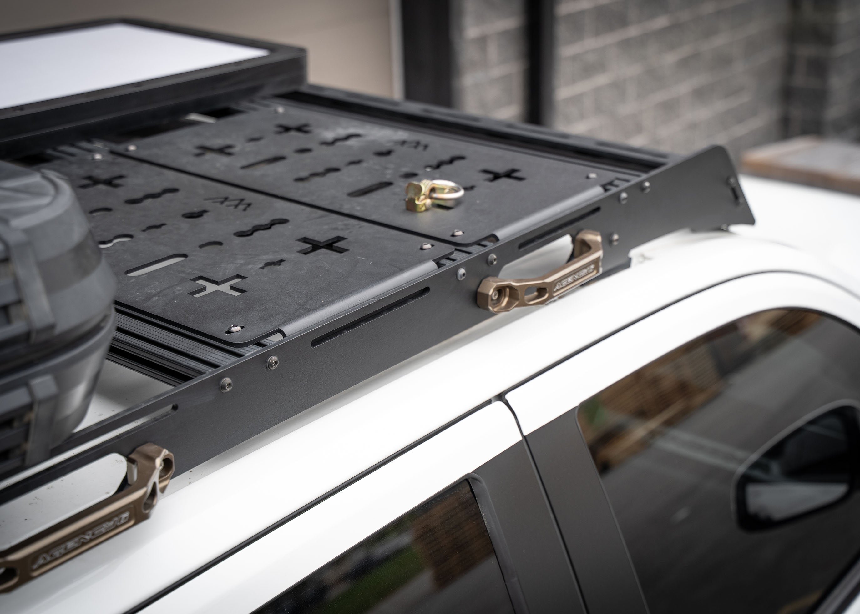 Image showing the side of the Backwoods Adventure Mods DRIFTR 2024 4th gen Toyota Tacoma roof rack with accessories installed