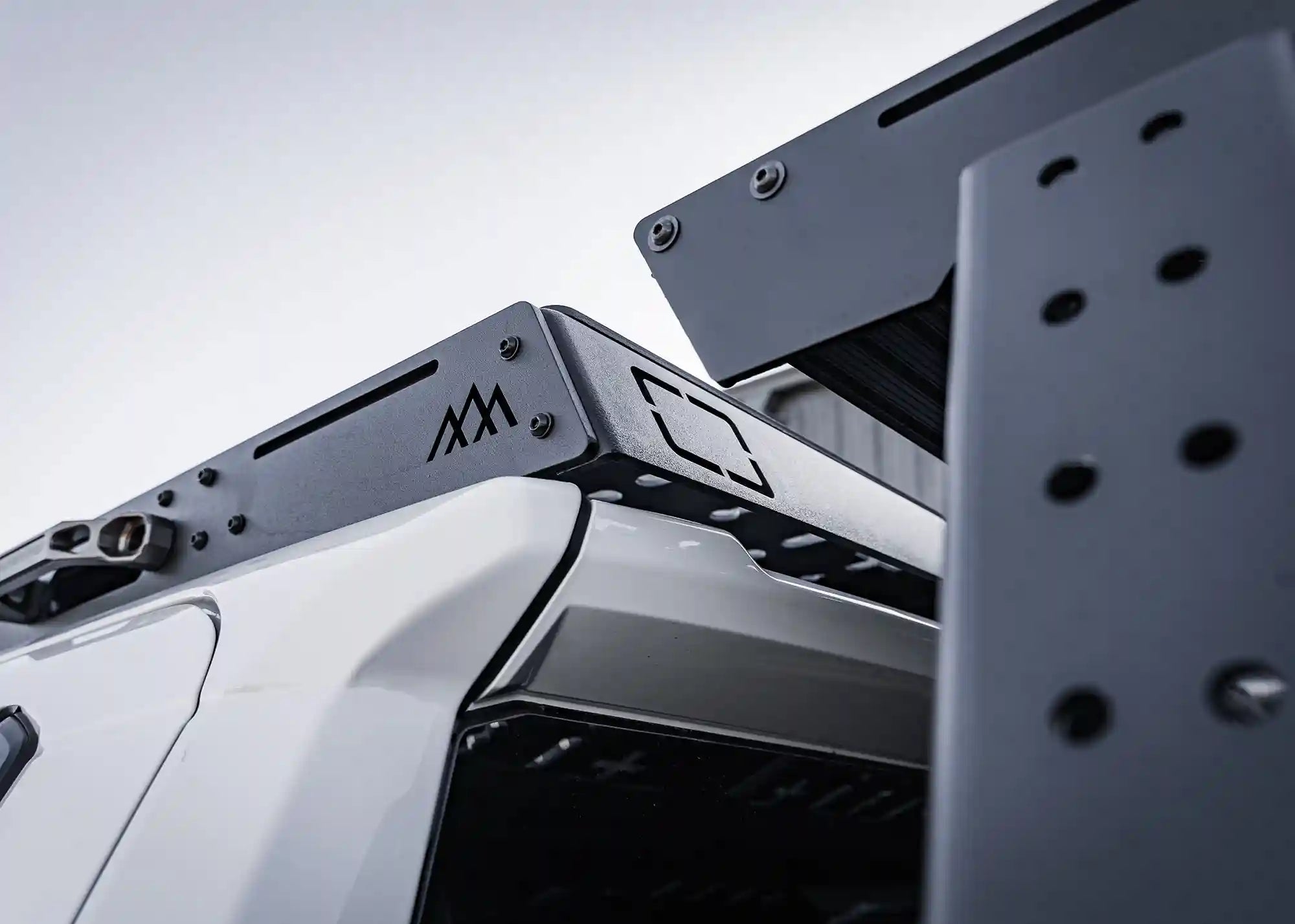 Close-up rear view of 2024 Tacoma Backwoods Adventure Mods DRIFTR roof rack 