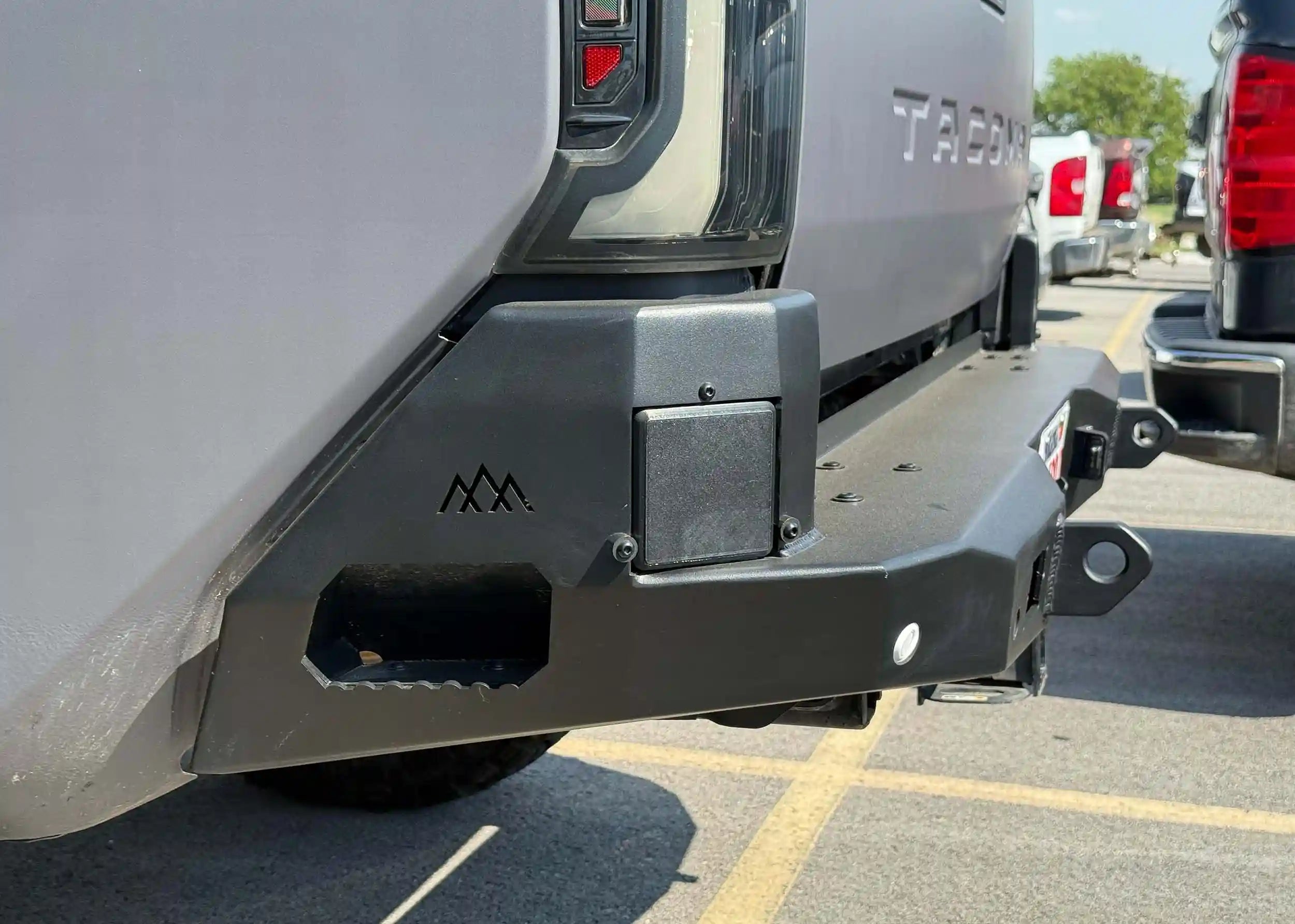 Close up of Toyota Tacoma Rear Bumper step on the Backwoods Adventure Mods Hi-lite Overland Rear Bumper installed on a 4th gen Tacoma
