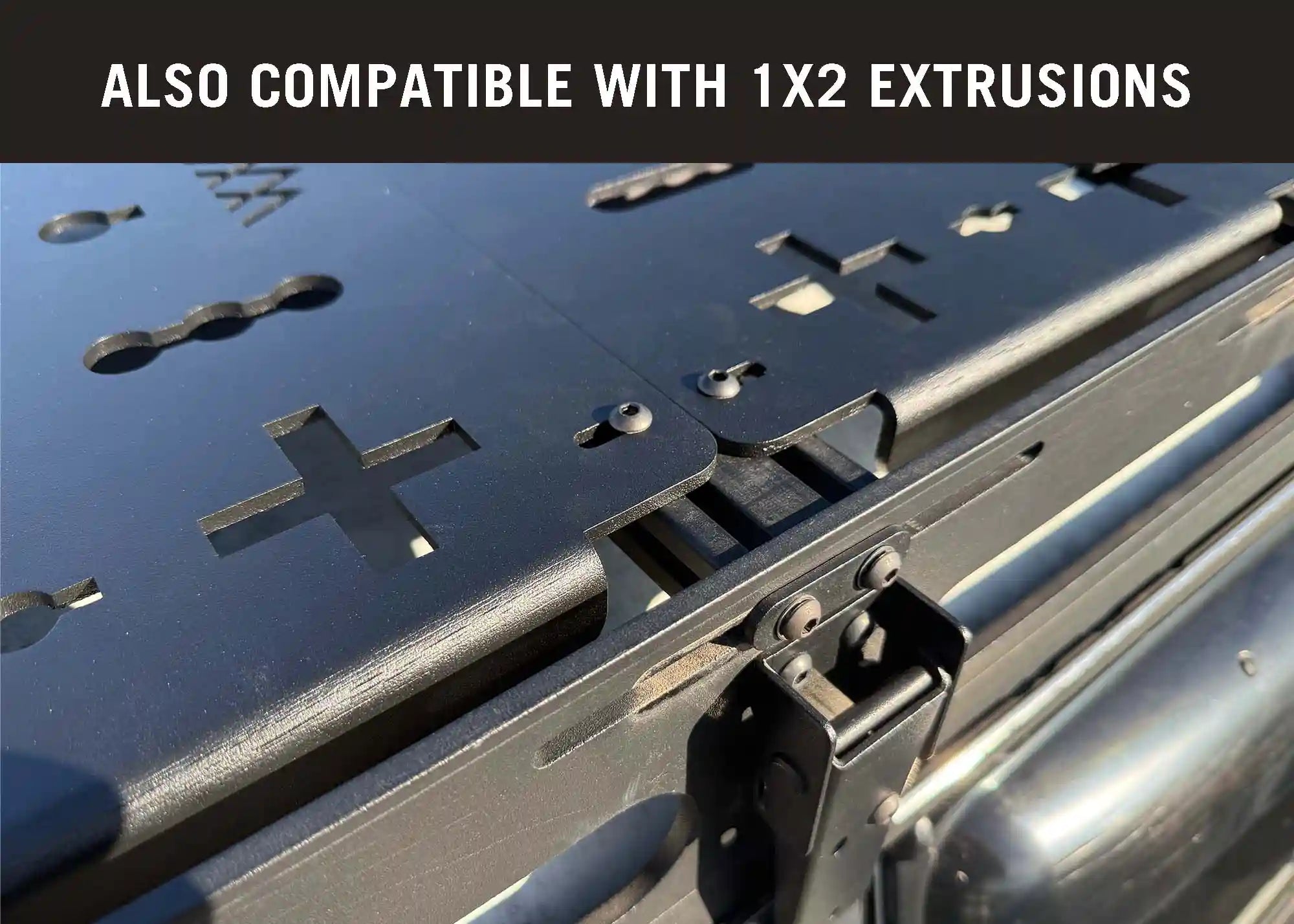 Image showing Backwoods Adventure Mods DRIFTR Roof Rack modular Accessory Deck Panels installed on a universal 1x2 aluminum extrusion roof rack load bar