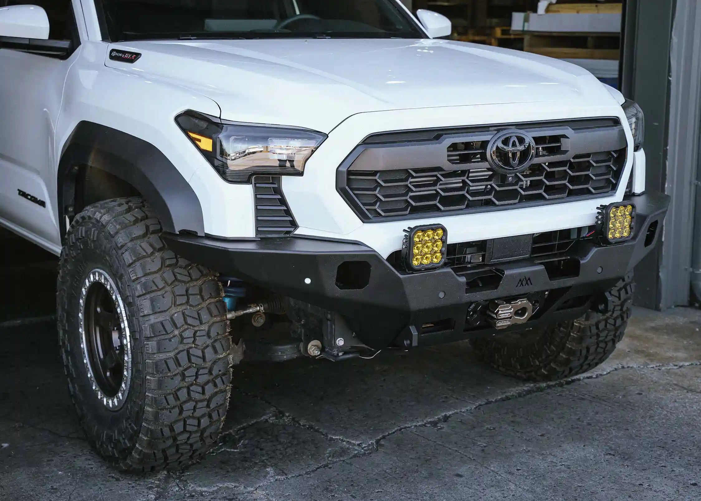 2024+ Toyota Tacoma Hi-Lite hybrid aluminum Front Bumper by Backwoods Adventure Mods installed on a 4th gen Tacoma