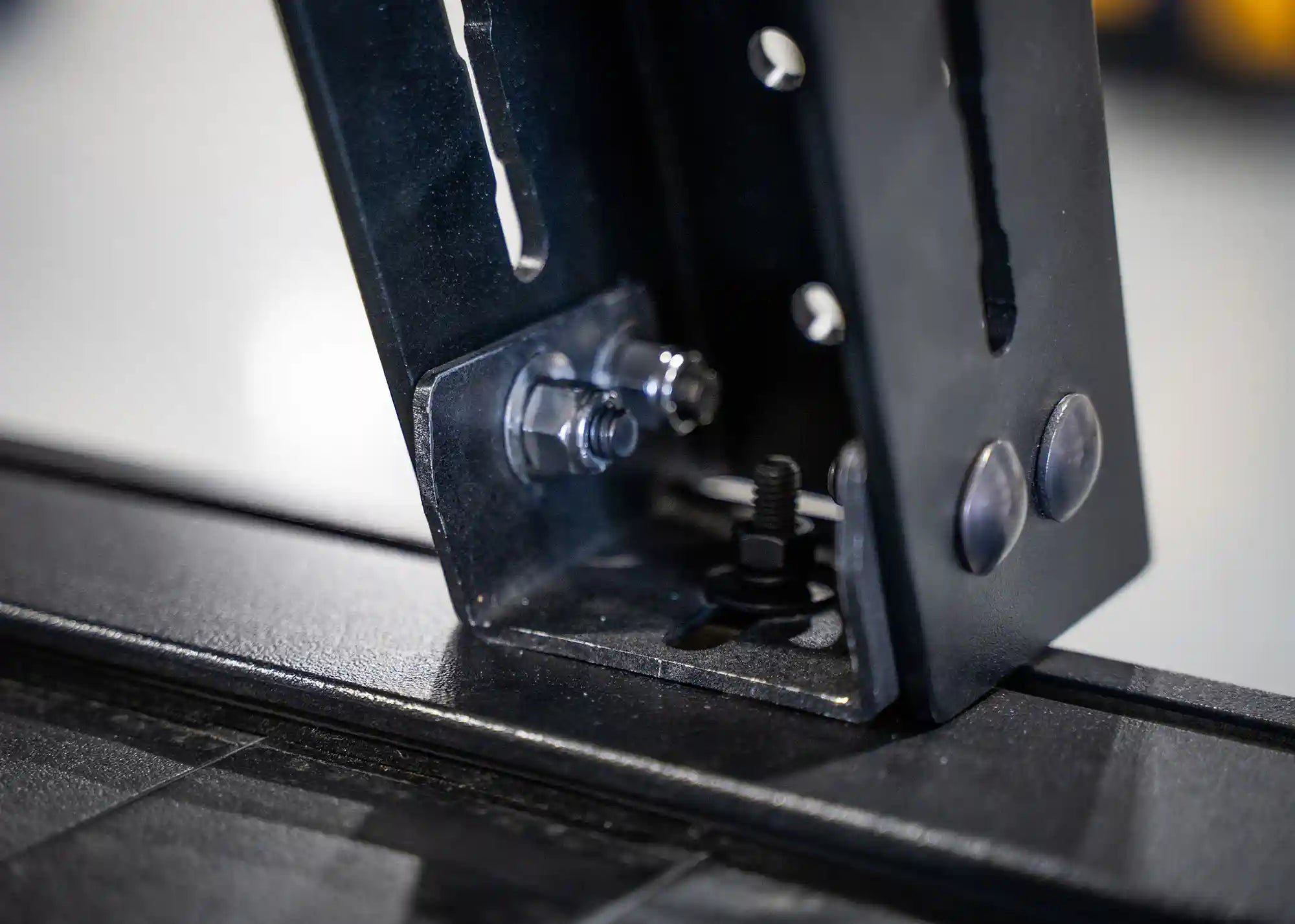 Close up of retractable bed cover bed rack adapter mount installed | Backwoods Adventure Mods