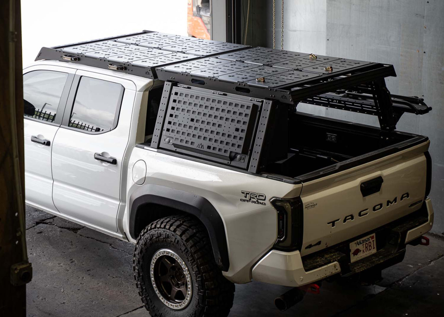 Toyota Tacoma Overland Bed Rack installed on a white 3rd gen Tacoma truck bed with other Backwoods Adventure Mods accessories