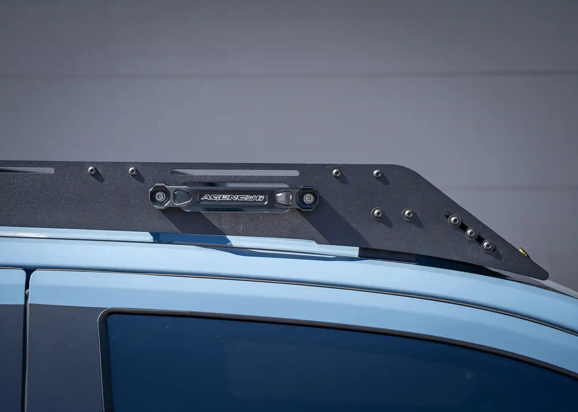 Close up of the grab handle accessory installed on the side of the DRIFTR 6th Gen 4Runner Roof Rack from Backwoods Adventure Mods