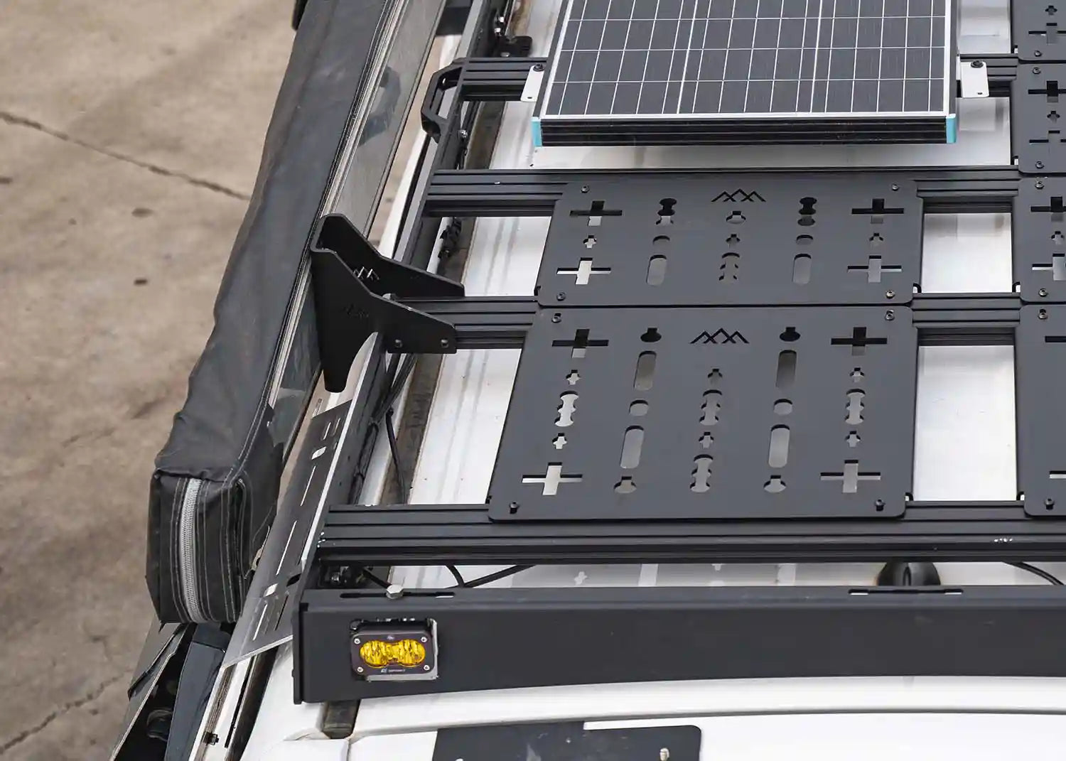 Awning installed on a Backwoods Adventure Mods DRIFTR Roof Rack using the HD Awning Brackets 