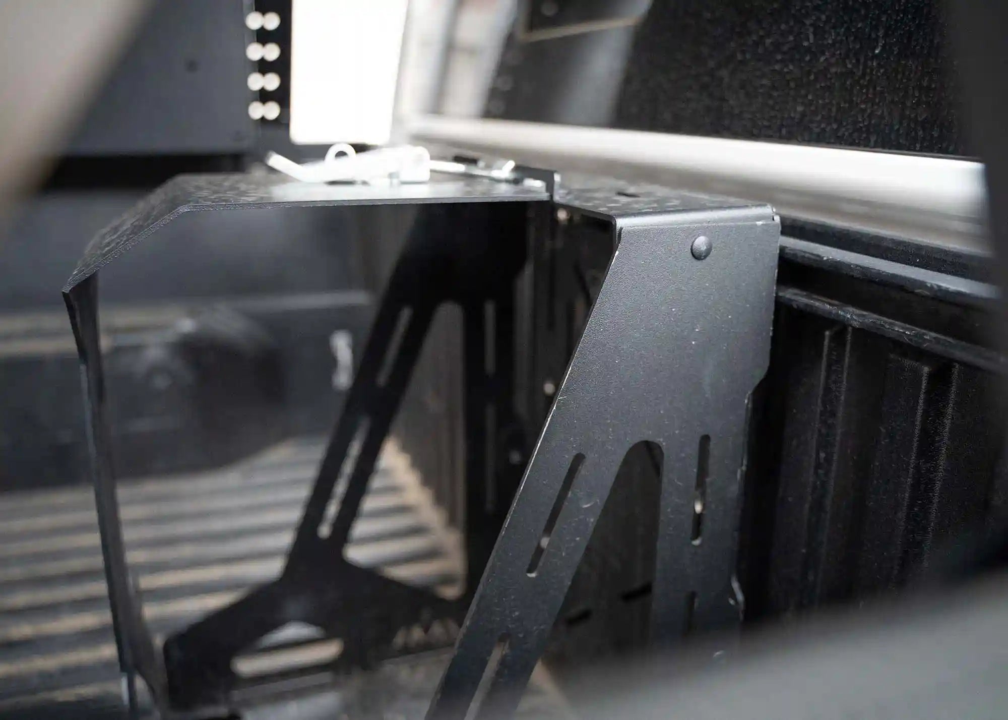 Close up of the Backwoods Adventure Mods Jerry Can Holder Mount powder coat finish