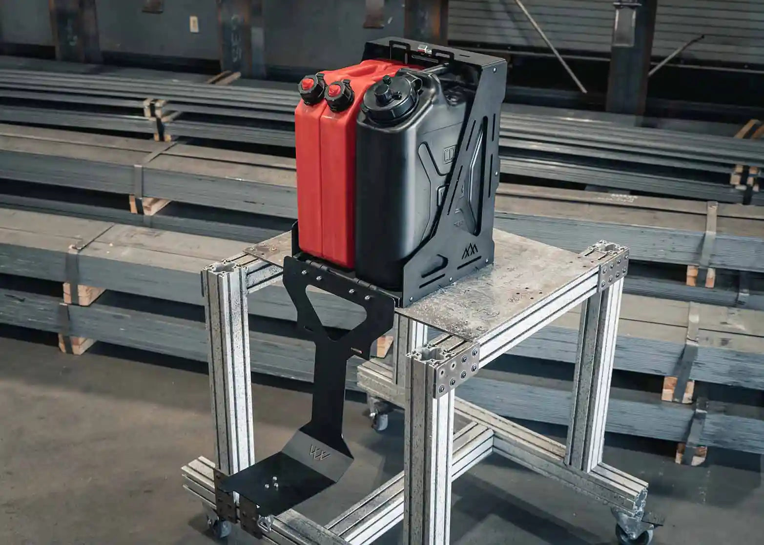 Image of an open Jerry's Can Holder - Dual Universal Jerry Can Mount from Backwoods Adventure Mods