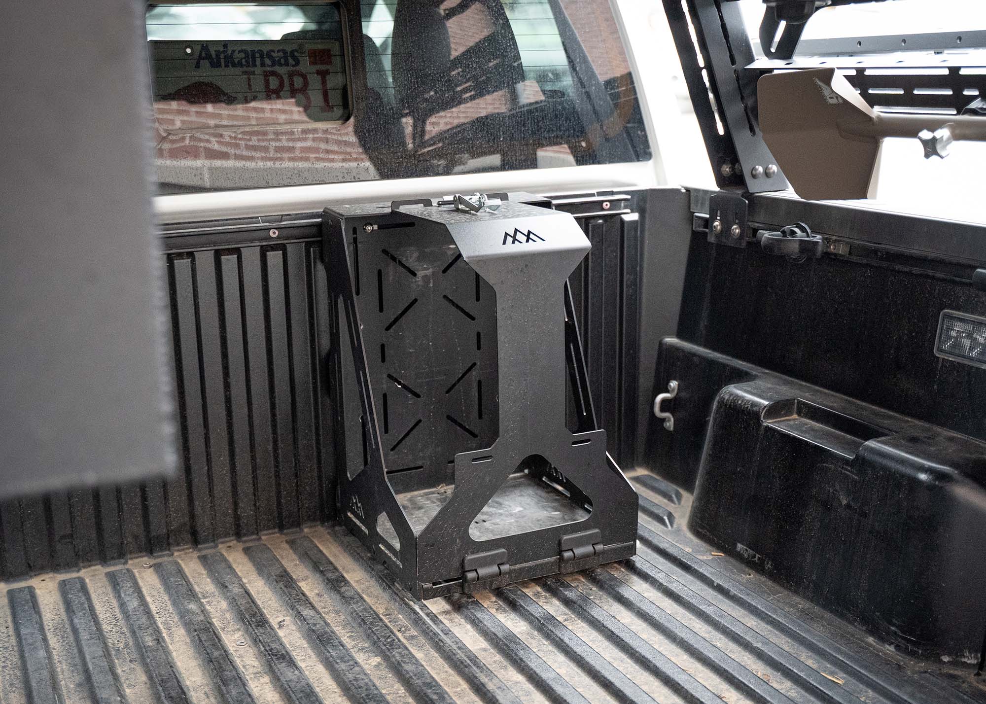 Backwoods Adventure Mods Jerry Can Holder Mount installed in a pickup truck bed