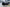 45 degree angle image of the right side and back of the Kali King hard shell rooftop tent from Freespirit Recreation open with windows closed | Backwoods Adventure Mods