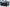 45 degree angle image of the back and left side of the Kali King hard shell rooftop tent from Freespirit Recreation deployed with windows and door open | Backwoods Adventure Mods