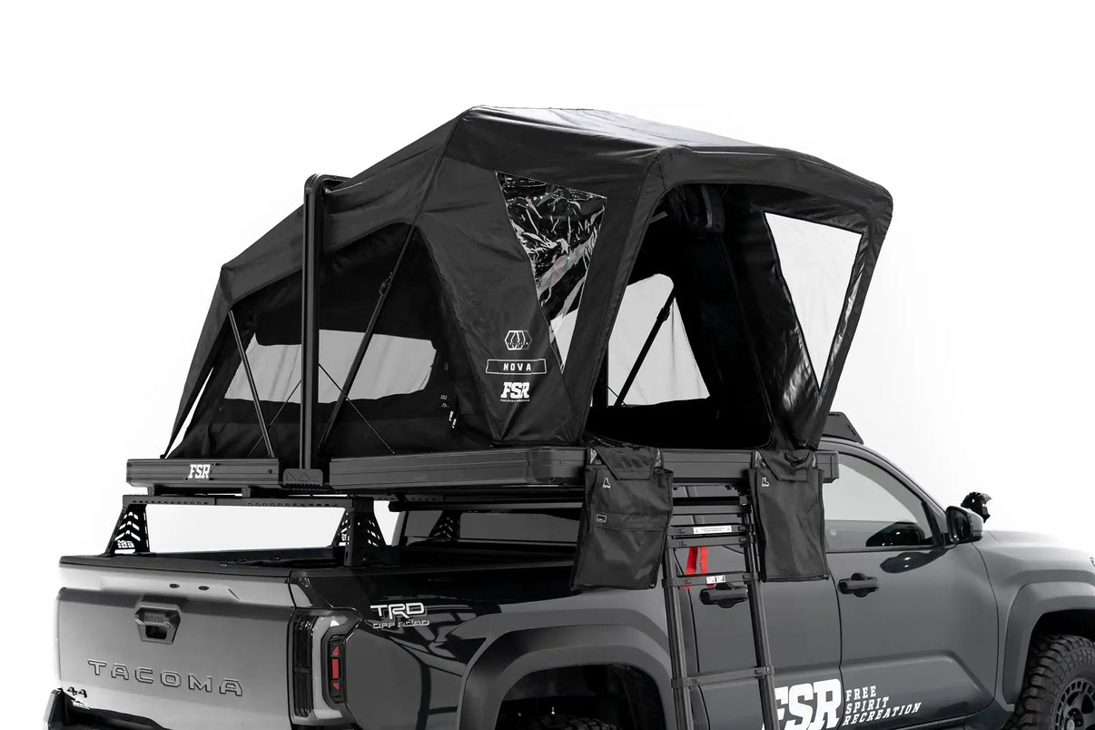 Photo of FSR Nova Standard Tri-Layer rooftop tent deployed on the rear of a black 2025 Toyota Tacoma. | Backwoods Adventure Mods