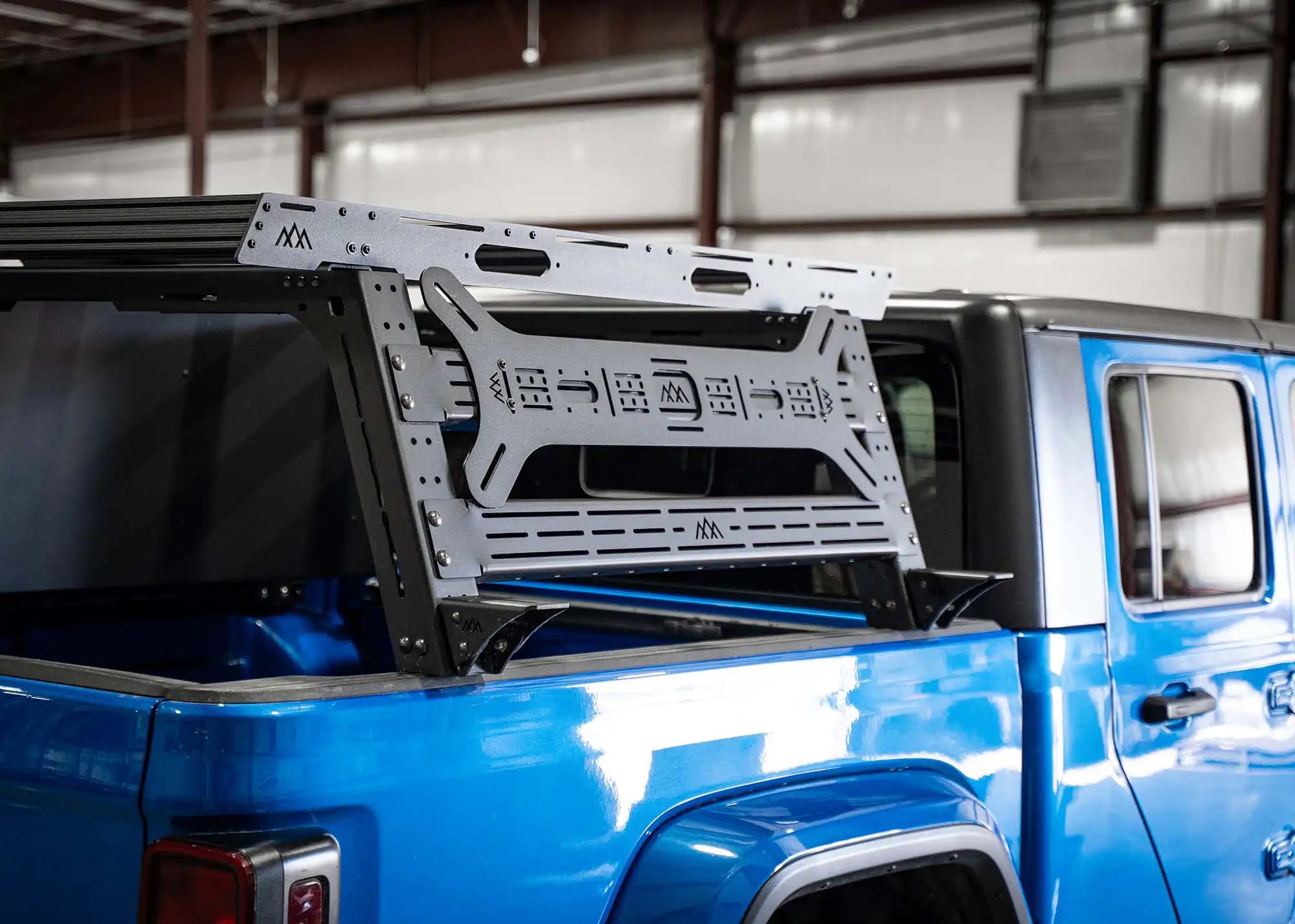 Passenger side view of the Backwoods Adventure Mods Jeep Gladiator Bed Rack