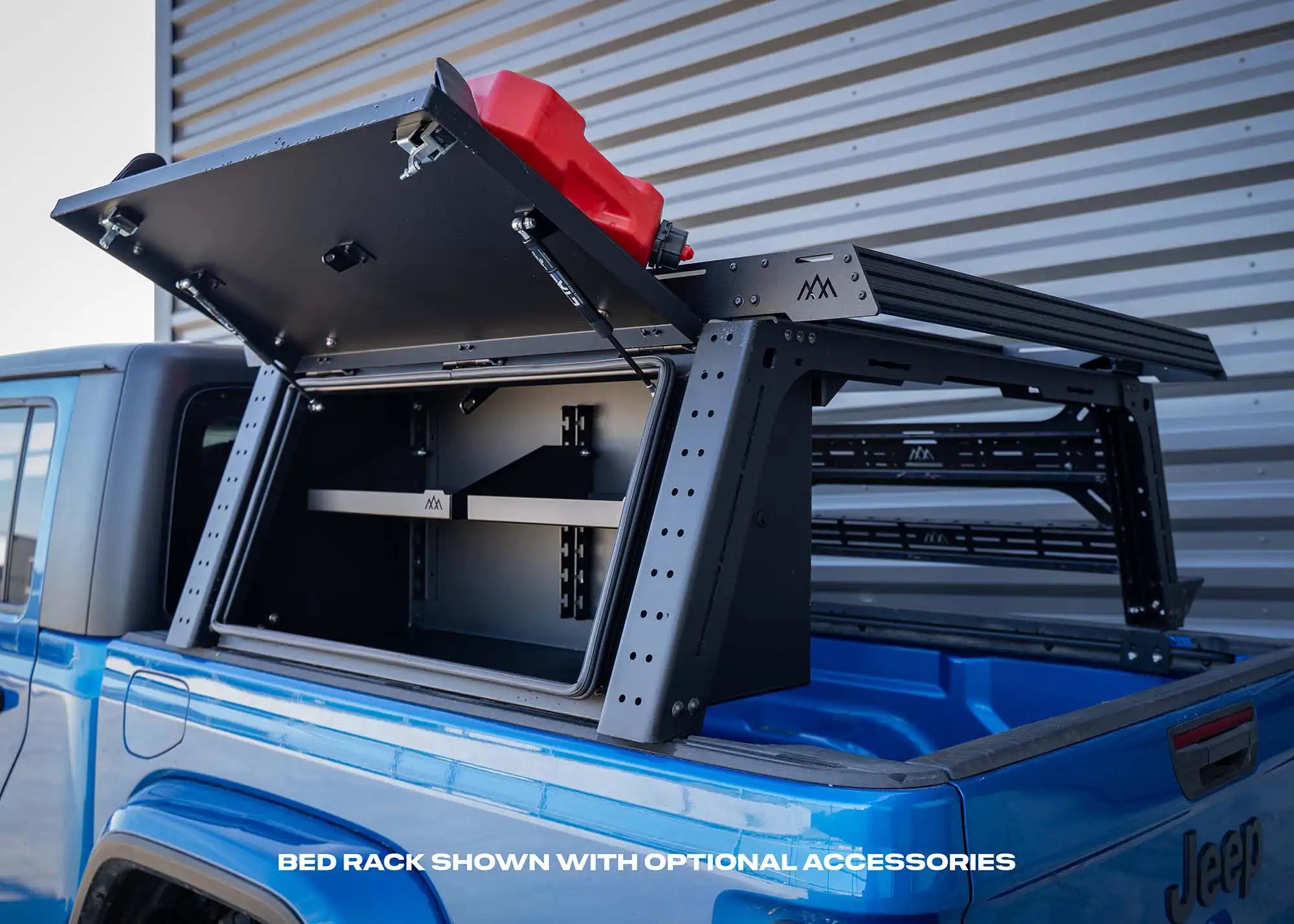 Backwoods Adventure Mods Jeep Gladiator Bed Rack with overland storage box installed and lid open showing interior adjustable shelving