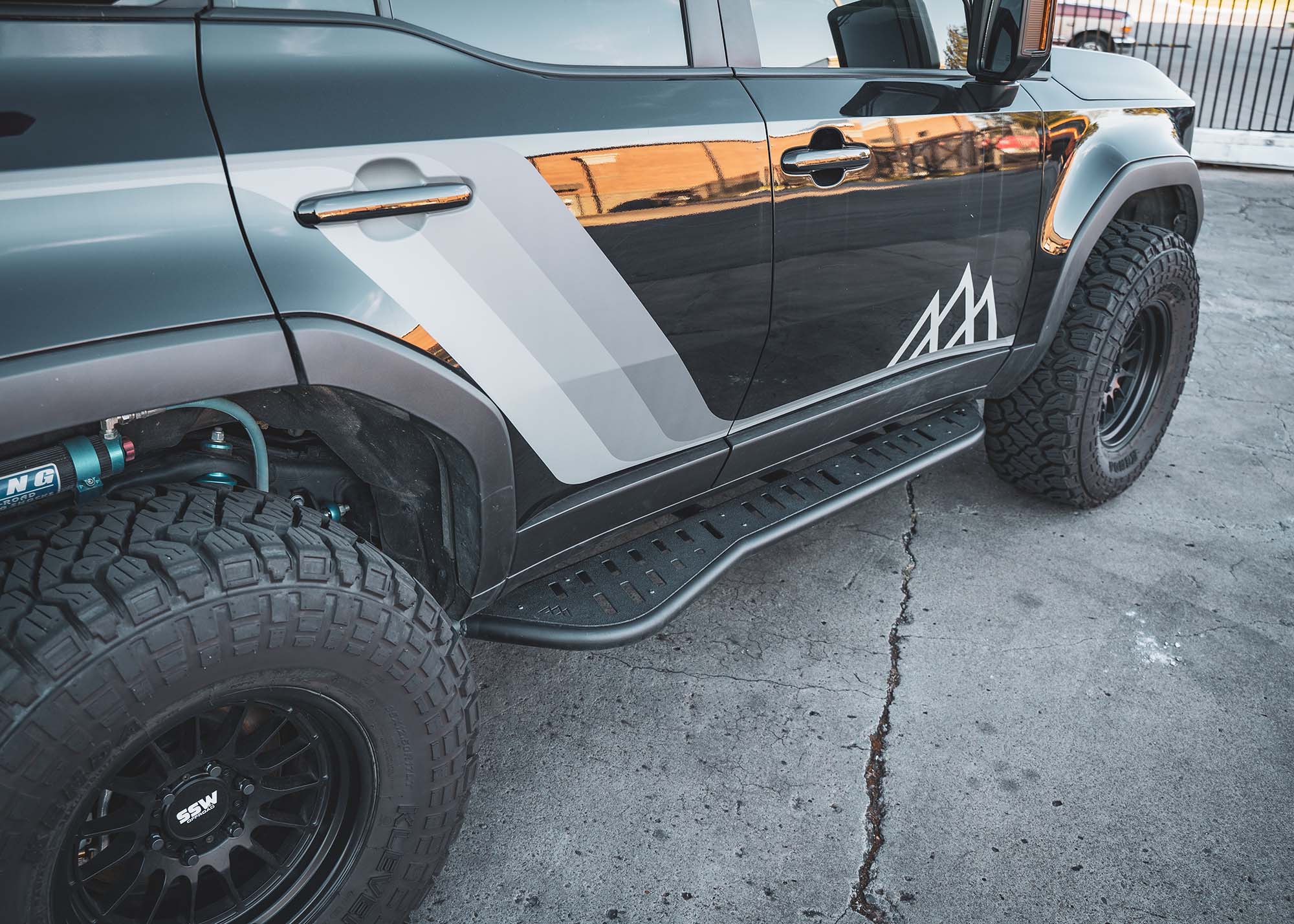 Black Landcruiser 250 with LC250 rock sliders installed from Backwoods Adventure Mods