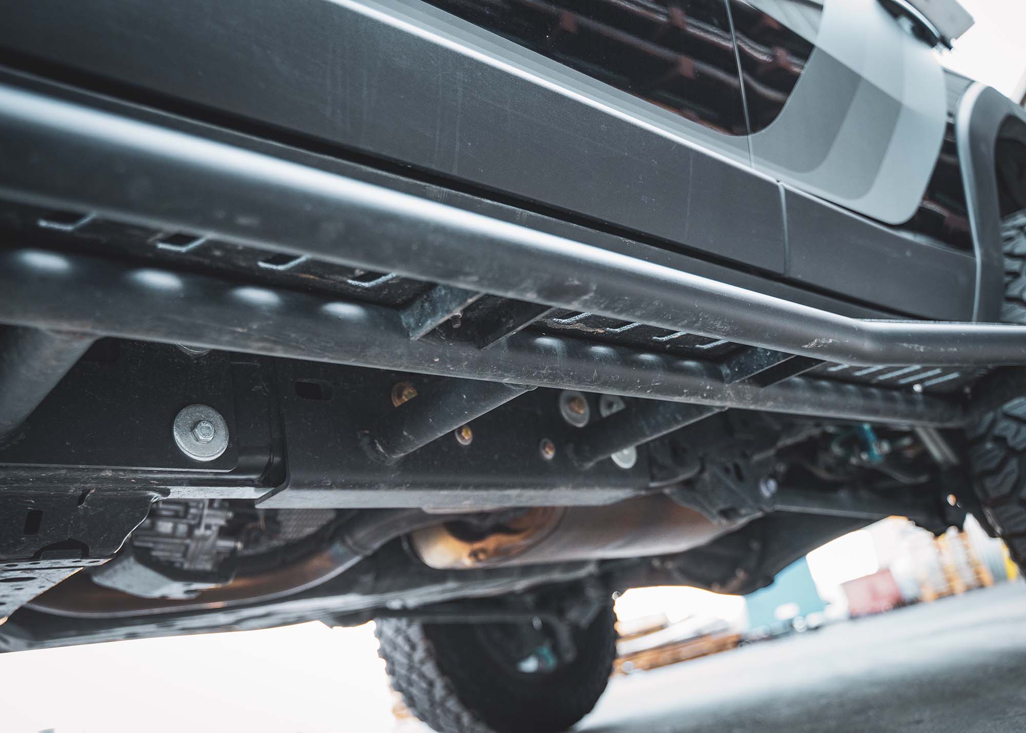 Close up of the bolt-on mount for the Landcruiser 250 LC250 Rock Sliders from Backwoods Adventure Mods