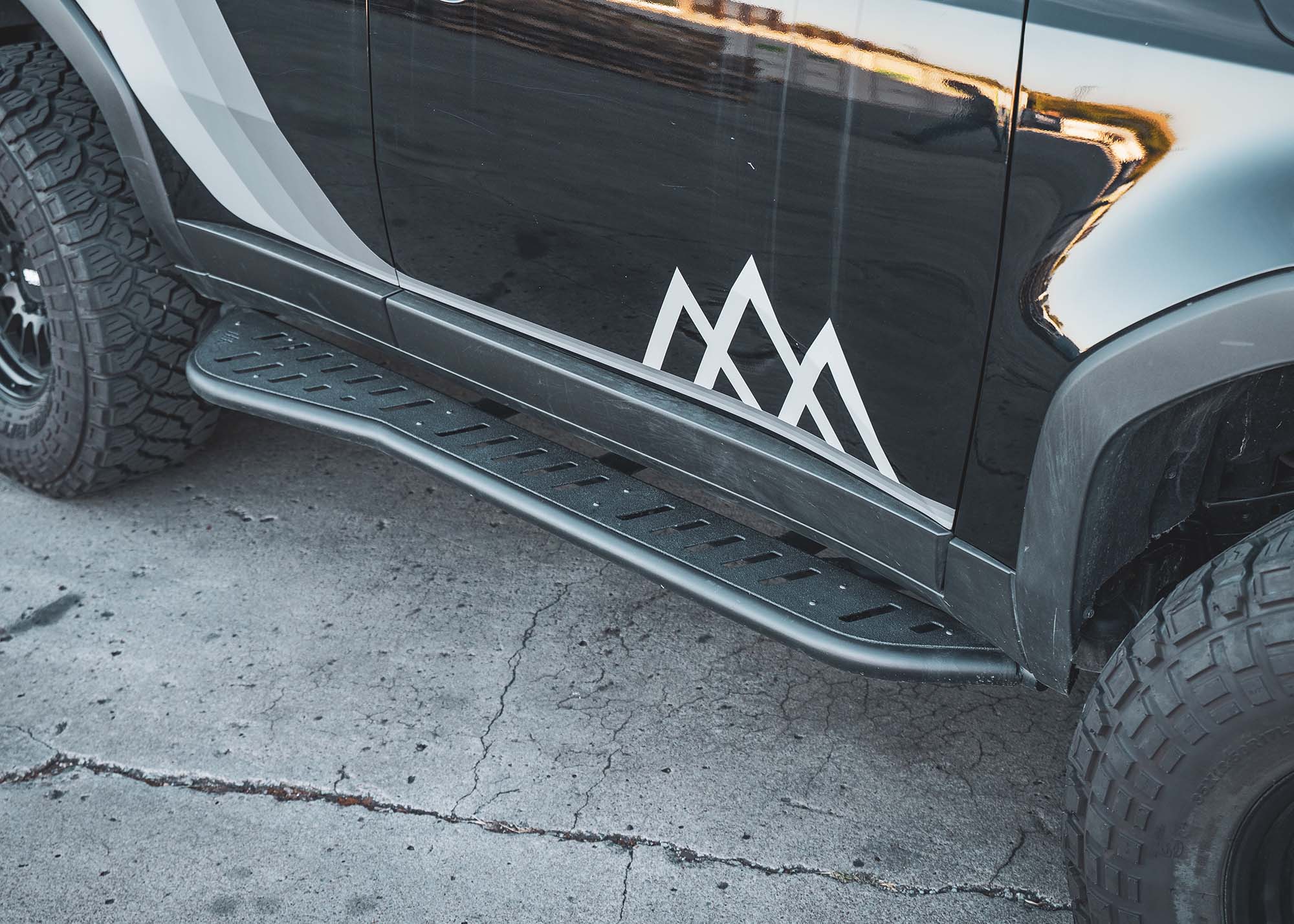 Close up of the side step on the Landcruiser 250 LC250 Rock Sliders from Backwoods Adventure Mods