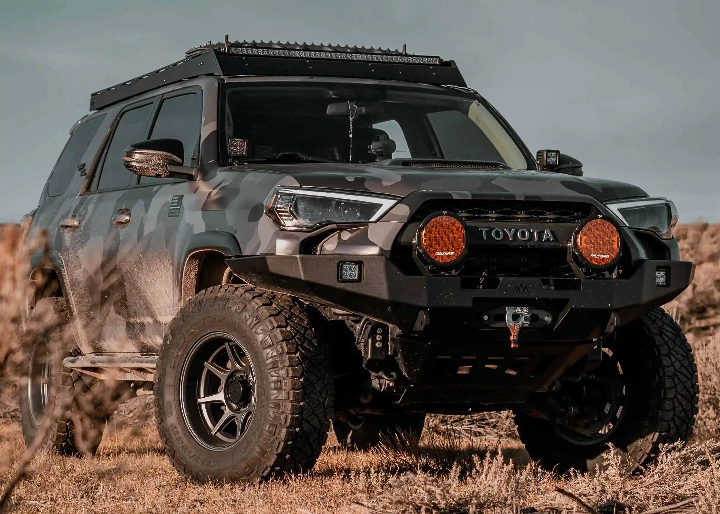 Pair of Pathfinder PROWLR 9 inch LED Off Road Driving Lights installed on a Backwoods Adventure Mods Hi-Lite series Toyota 4Runner hybrid high clearance bumper