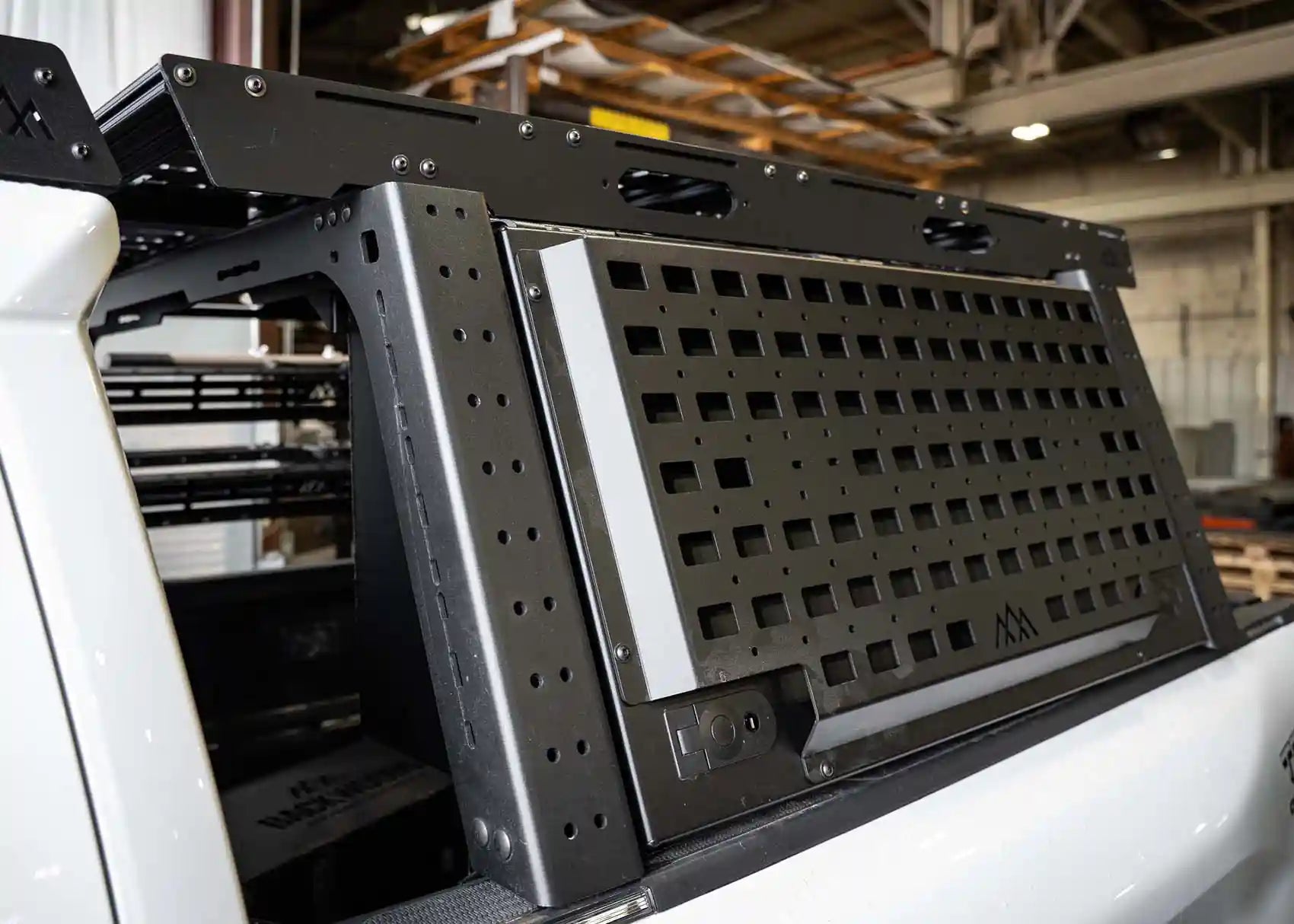 Image of the front side of the Backwoods Adventure Mods Toyota Tacoma bed rack storage box